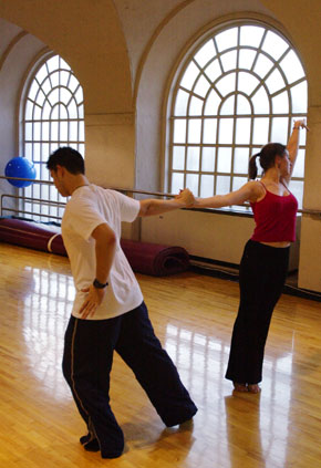 Eric Price and Emily Wilcox hold hands during dance pose