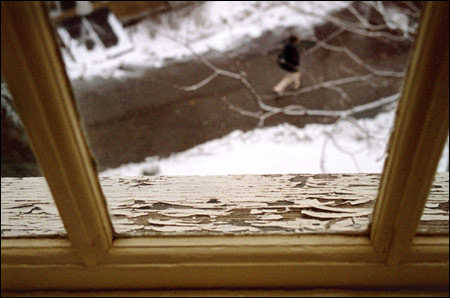 Student seen through Dudley window