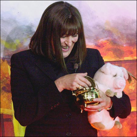 Anjelica Huston, plush pig, and pot o'