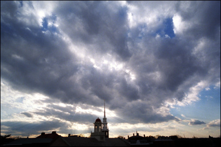dramatic sky over Memorial Church and Cambridge Fire Dept.