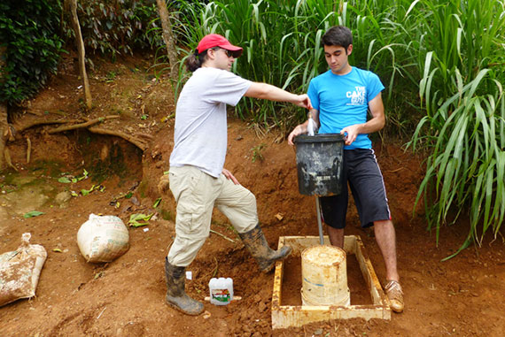 Christopher Lombardo (left) and William Jameson ’16 tested the flow rate from one of the newly installed tap stands.