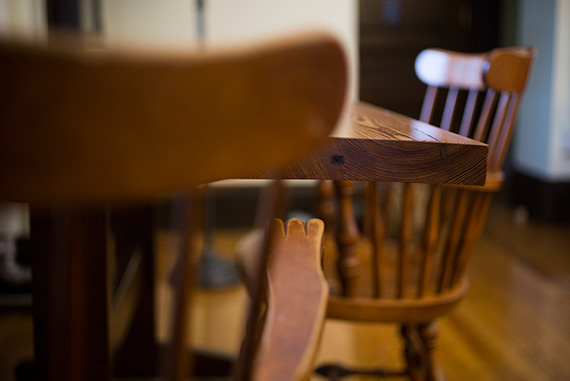 According to some, Seamus Heaney used an unhinged door from the suite as a desk. To keep the tradition alive, Adams House Master Sean Palfrey had a table made to look like a door for the refurbished suite.