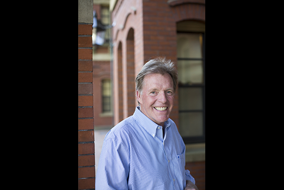 Boston Herald photographer Ted Fitzgerald is pictured in Harvard Yard. Photo by Stephanie Mitchell/Harvard Staff Photographer