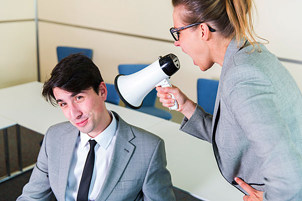 Woman with mic yellling at man