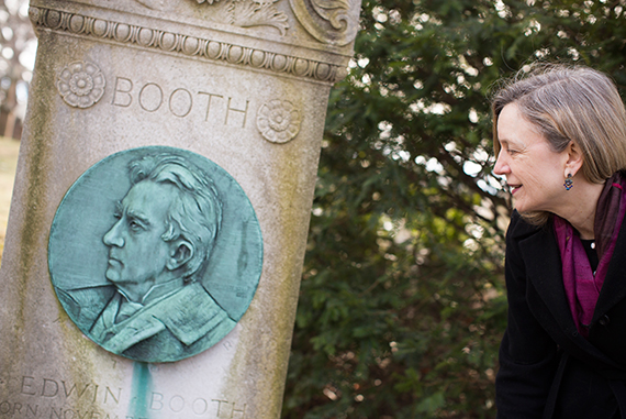 Melissa Banta looks at the monument for Edwin Booth, brother of John Wilkes Booth.