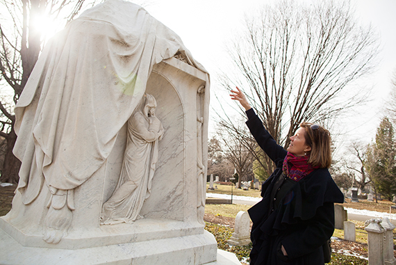 Meg Winslow strolls through the grounds speaking about her favorite monuments, including the recently restored monument to Amos Binney.