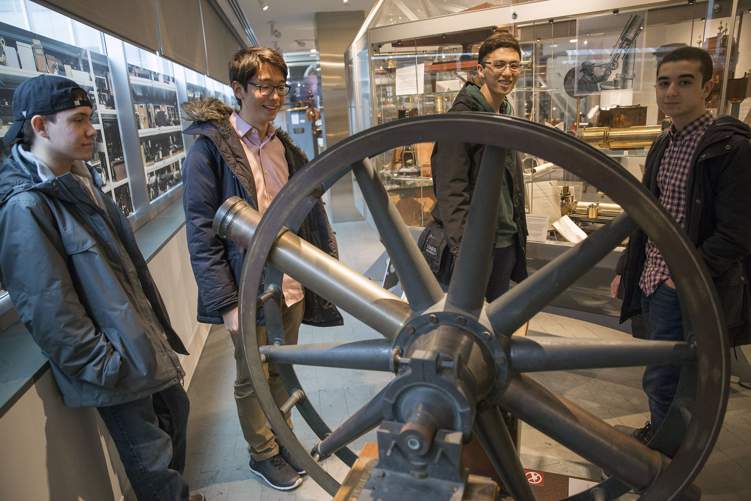 Roommates, Clifford "Scotty" Courvoisier, Kenneth Shinozuka, Sung Ahn, and Abdelrhman "Abdul" Saleh, (from far rear left to right), All class of '20 who live in Holworthy Hall, view a "Transit Circle" inside The Collection of Historical Scientific Instruments in the Science Center.