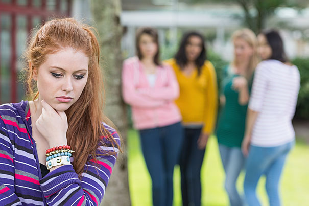 Student being bullied by a group of students