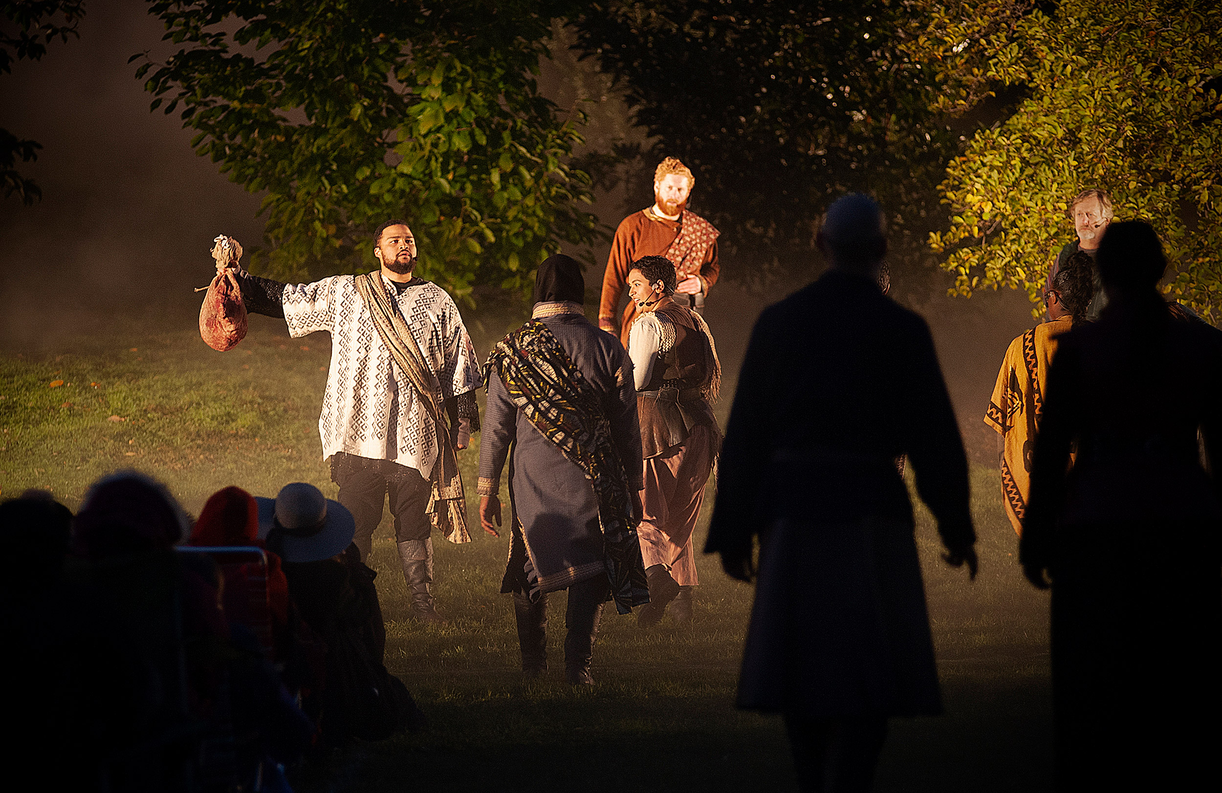 Malcolm (left), played by Kai Tshikosi, holds Macbeth’s head and claims his title.