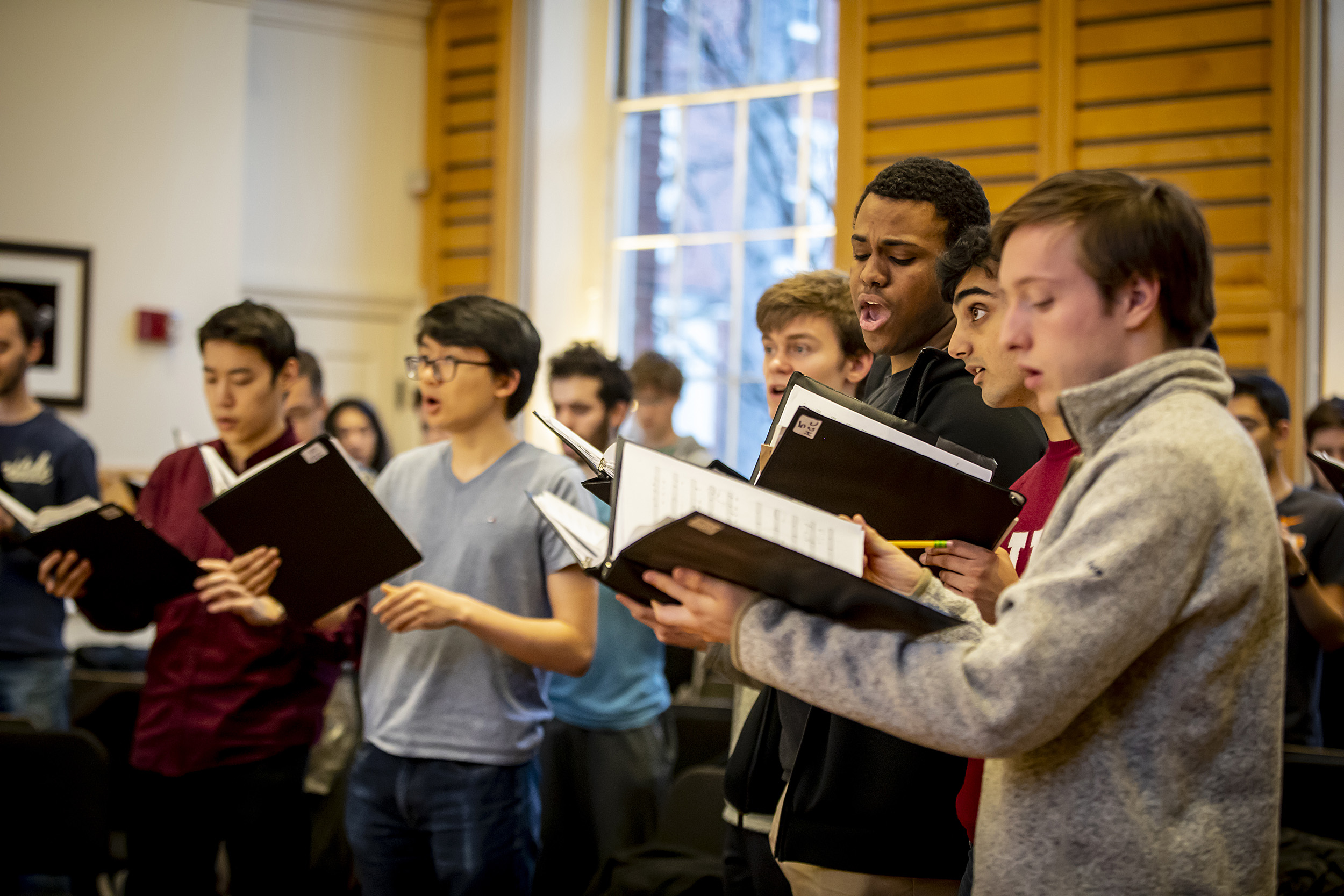 The Glee Club rehearses.