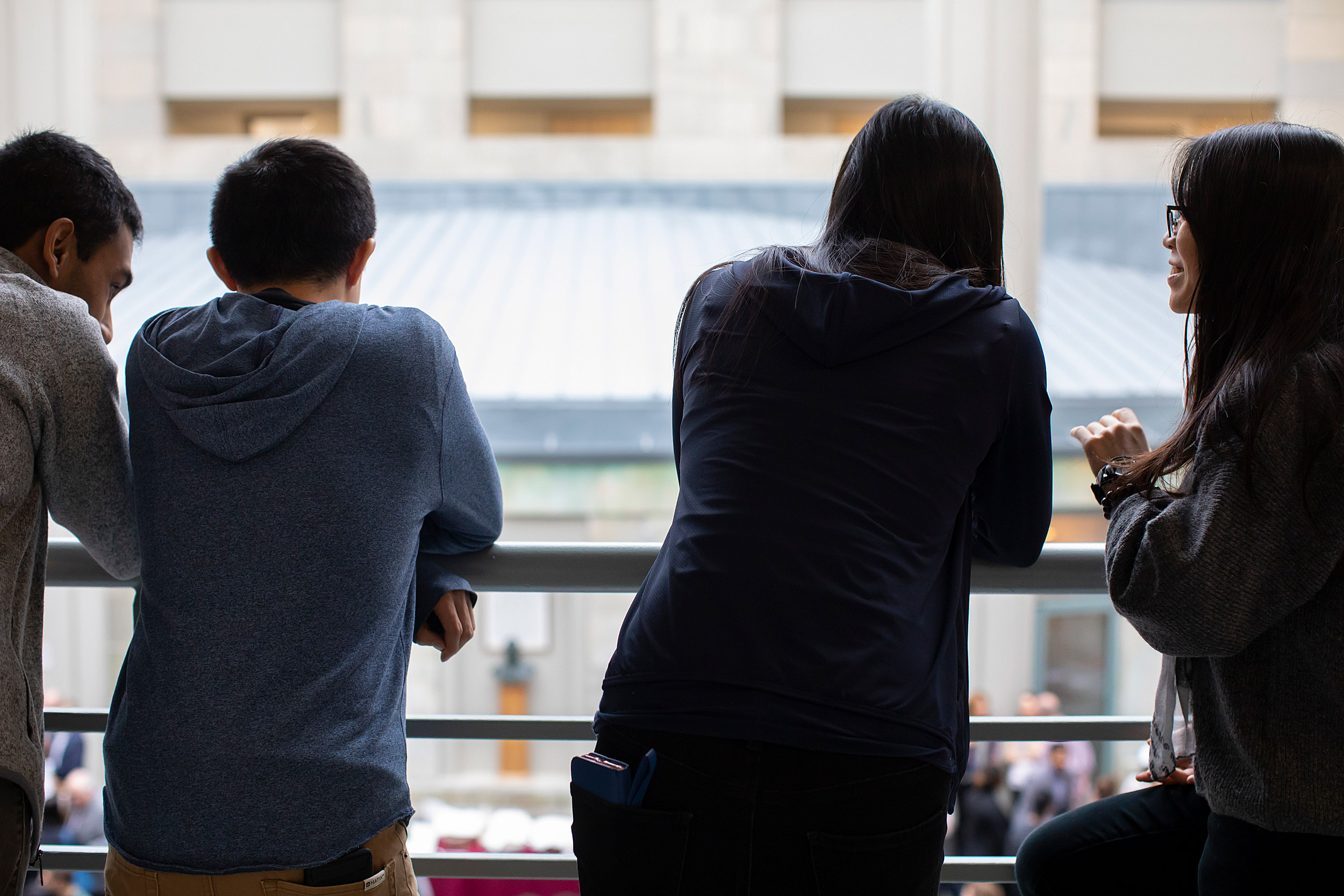 Students watch the Match Day festivities from the balcony at the Medical School.