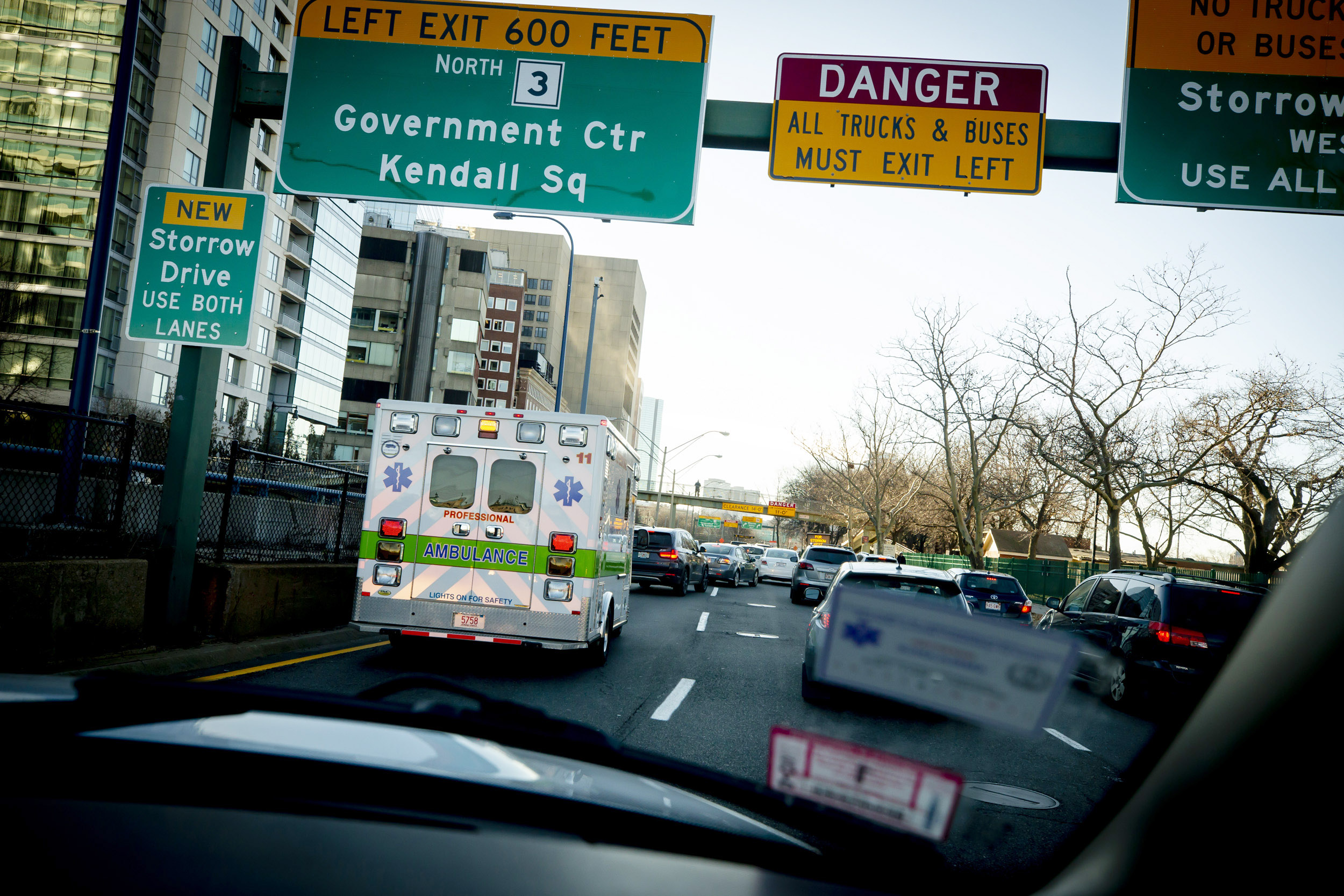 The ambulance navigates Memorial Drive traffic.