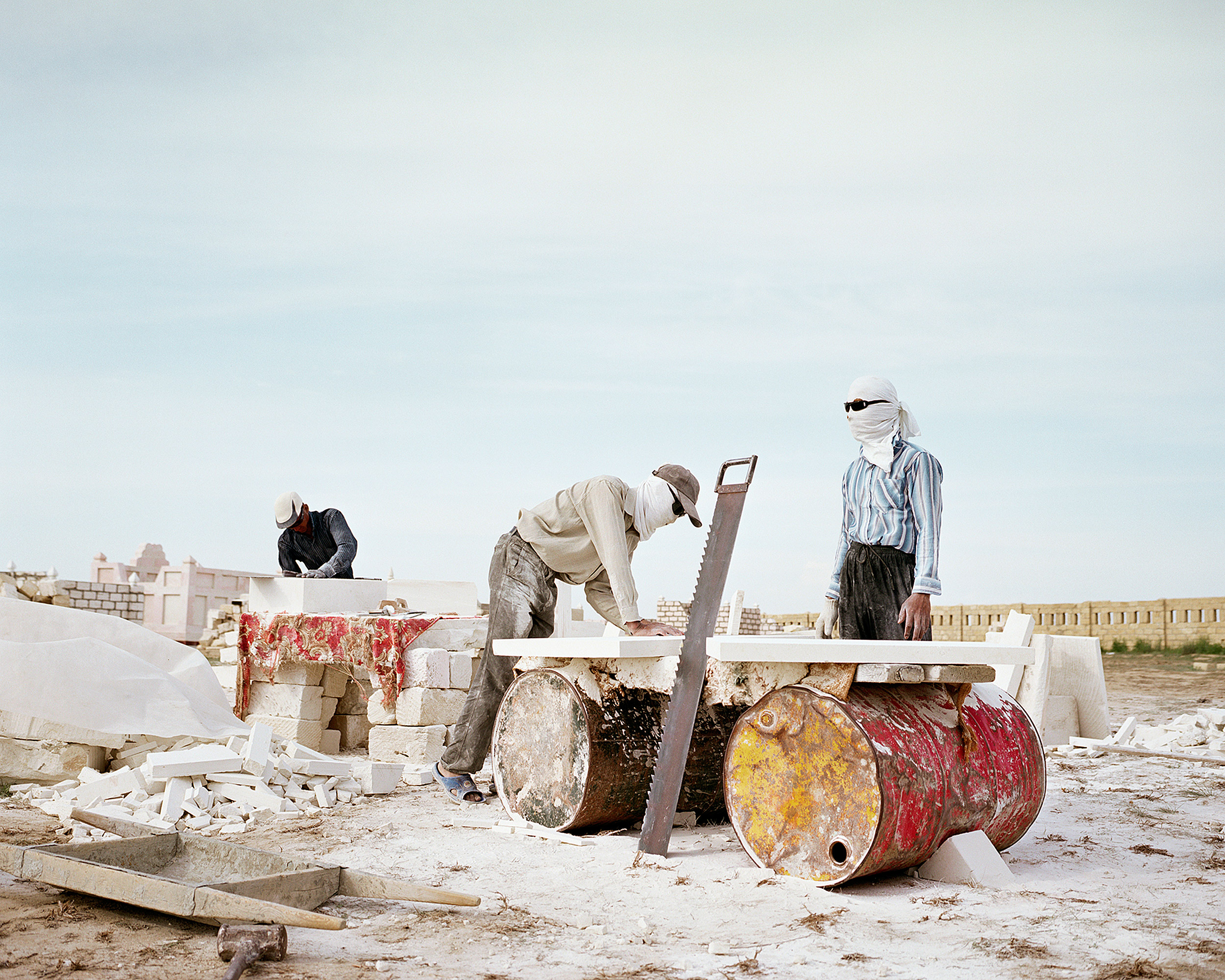 Workers crafting mausoleums