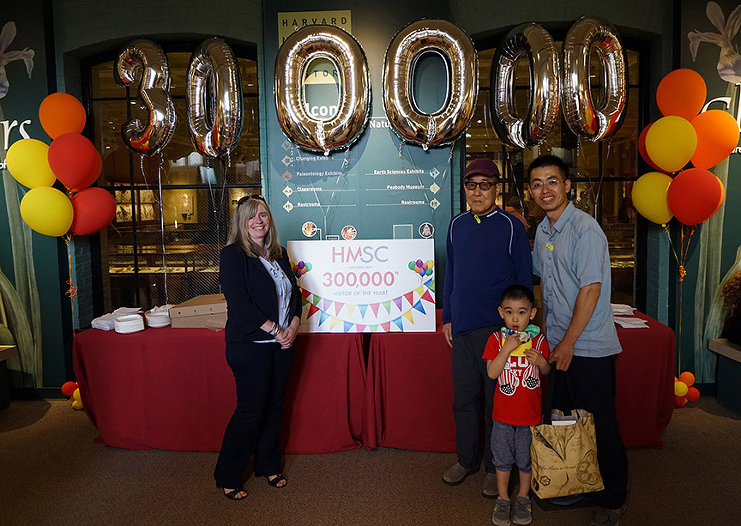 The 300,000 visitors to the museum standing with balloons