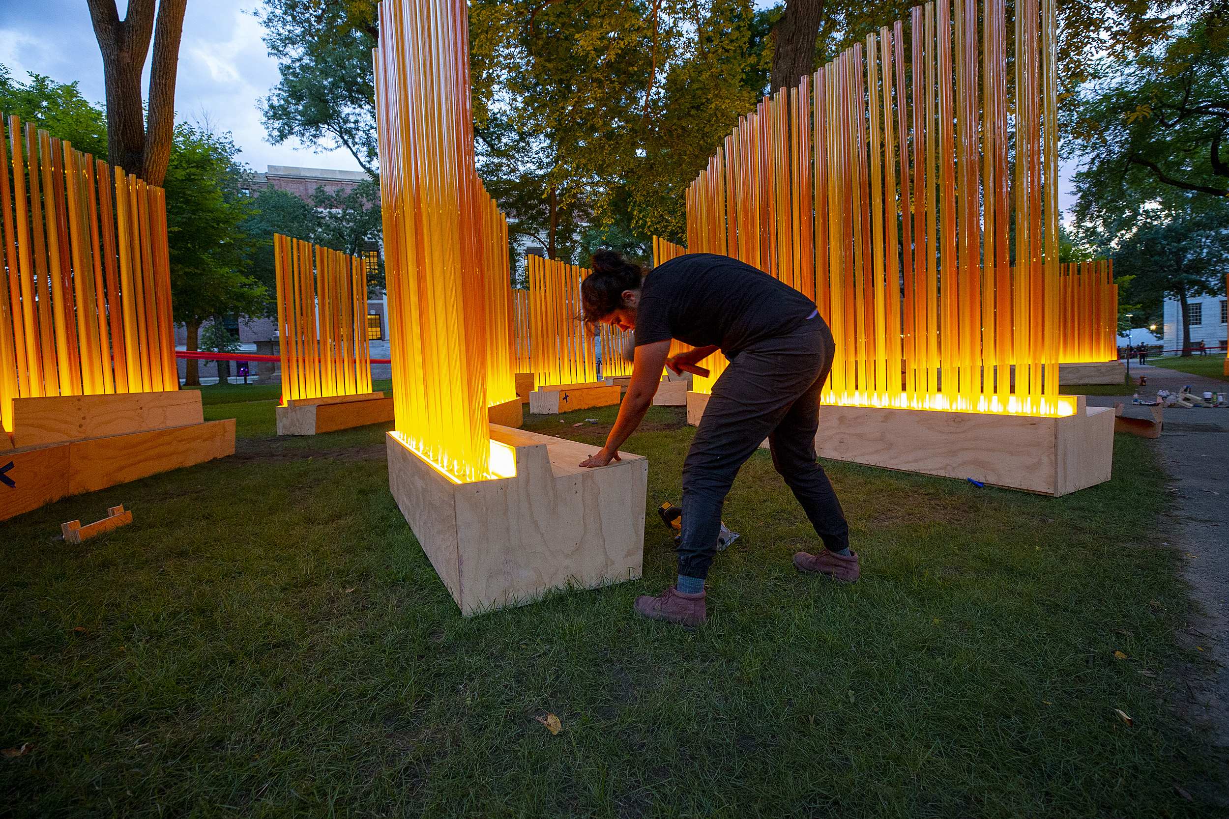 A woman putting the art installation together