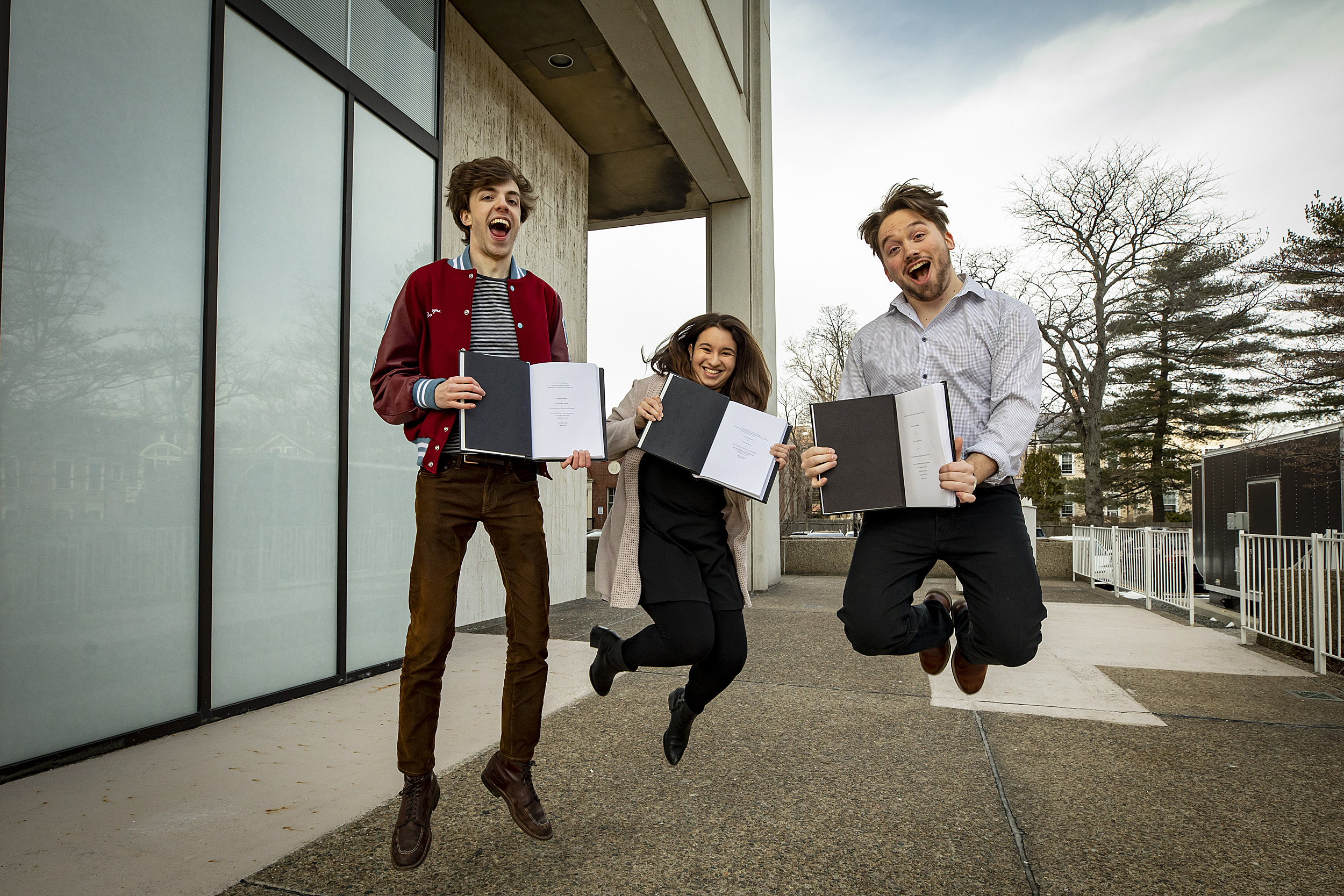 David Shayne, from left, Juliana Rodriguez, and Trevor Levin, senior concentrators in Social Studies handed in their thesis on "Thesis Day."