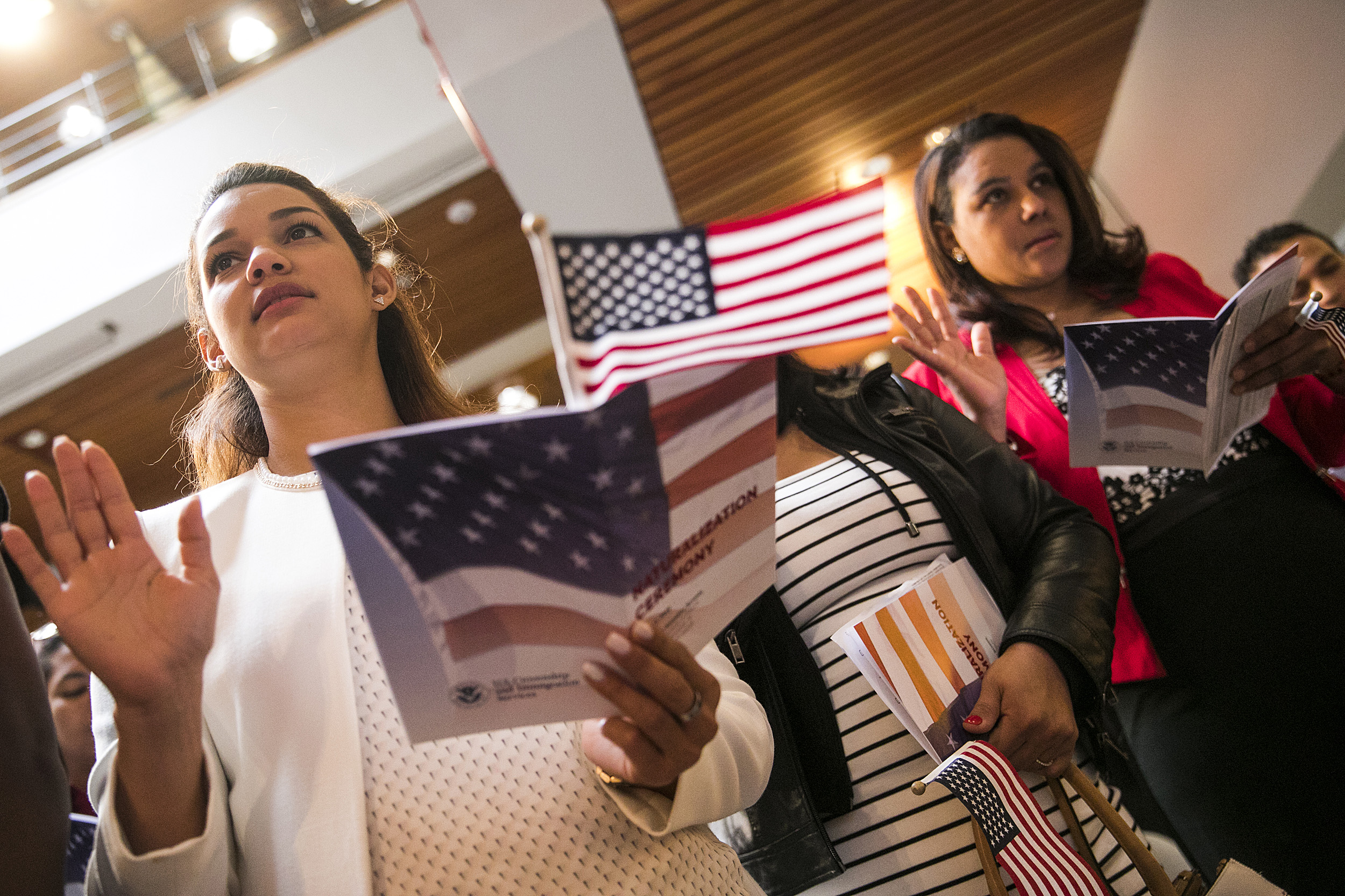 two women pledging during a citizenship ceremony