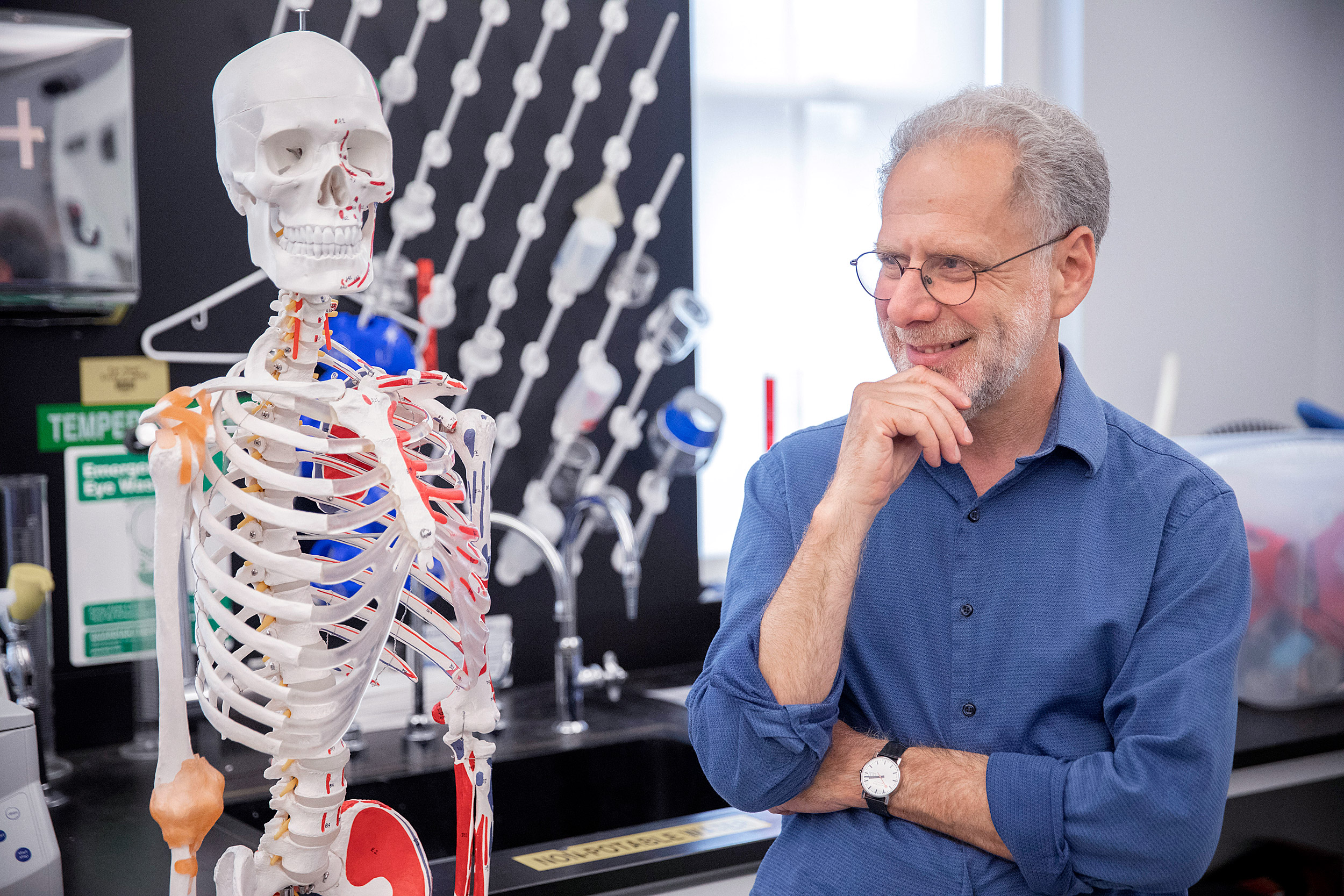 Professor Daniel Lieberman standing in his lab.