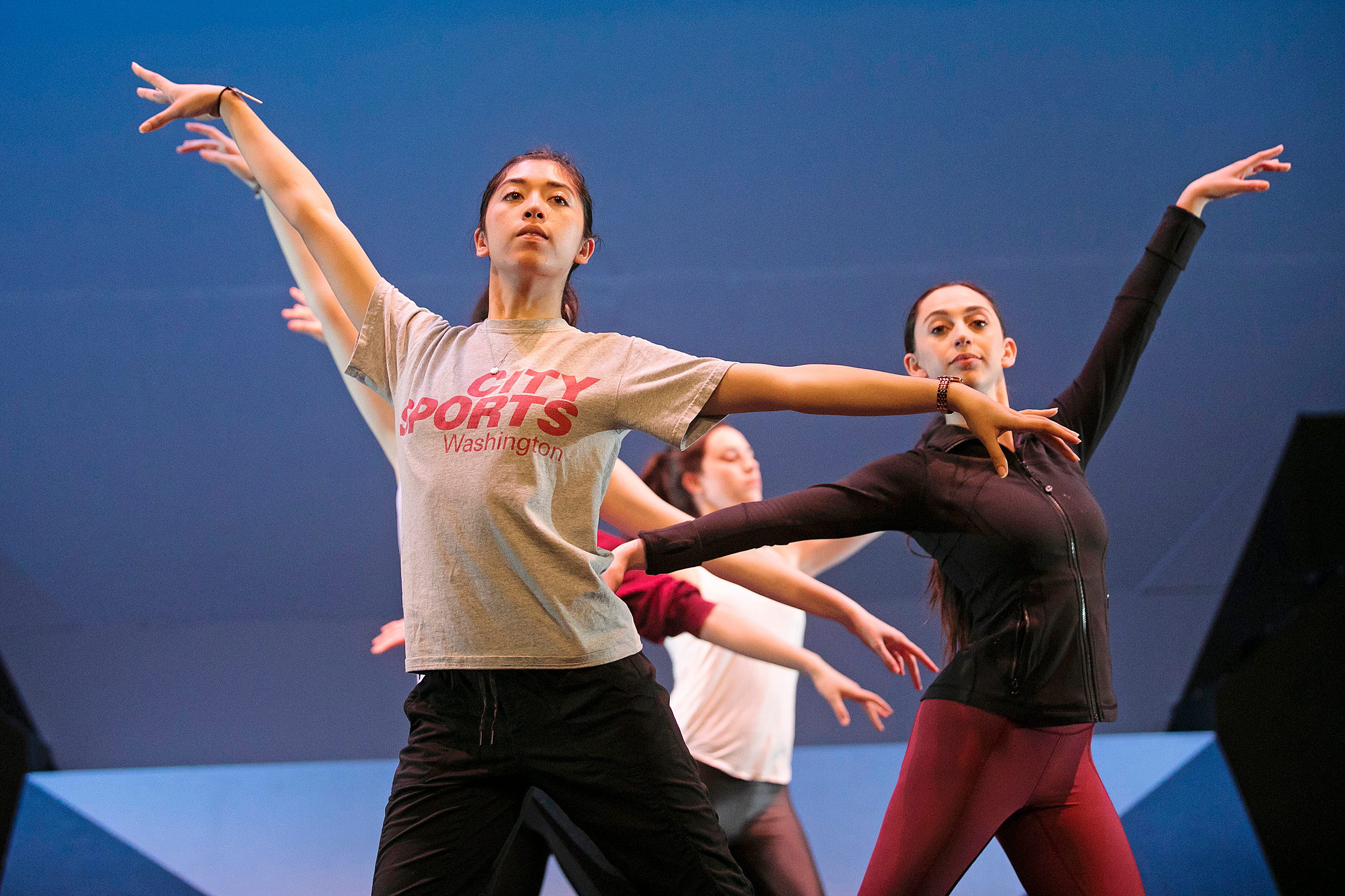 Dancers practice upper-body positions.