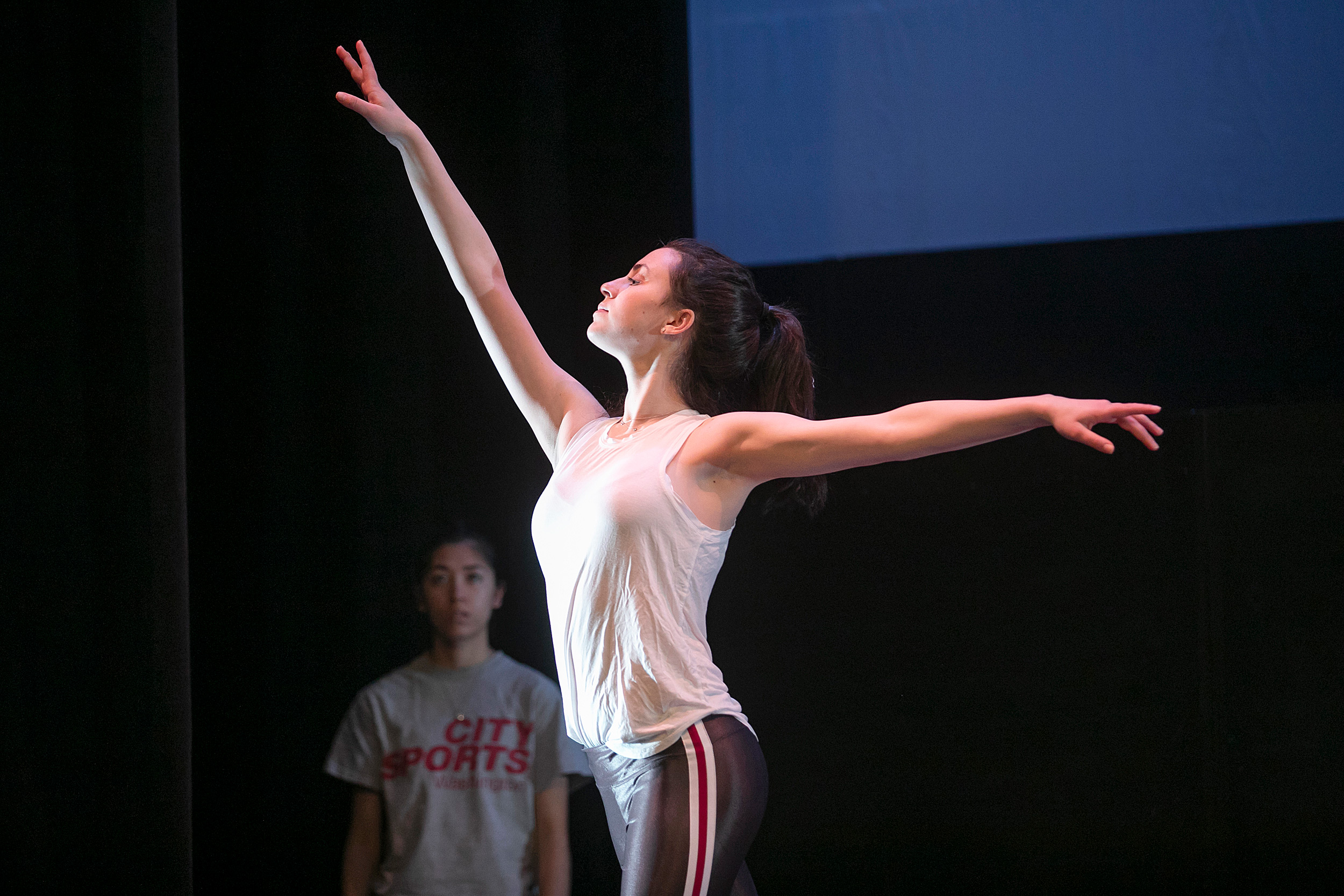 Isabelle Jaffe holds her arms out at different angles.