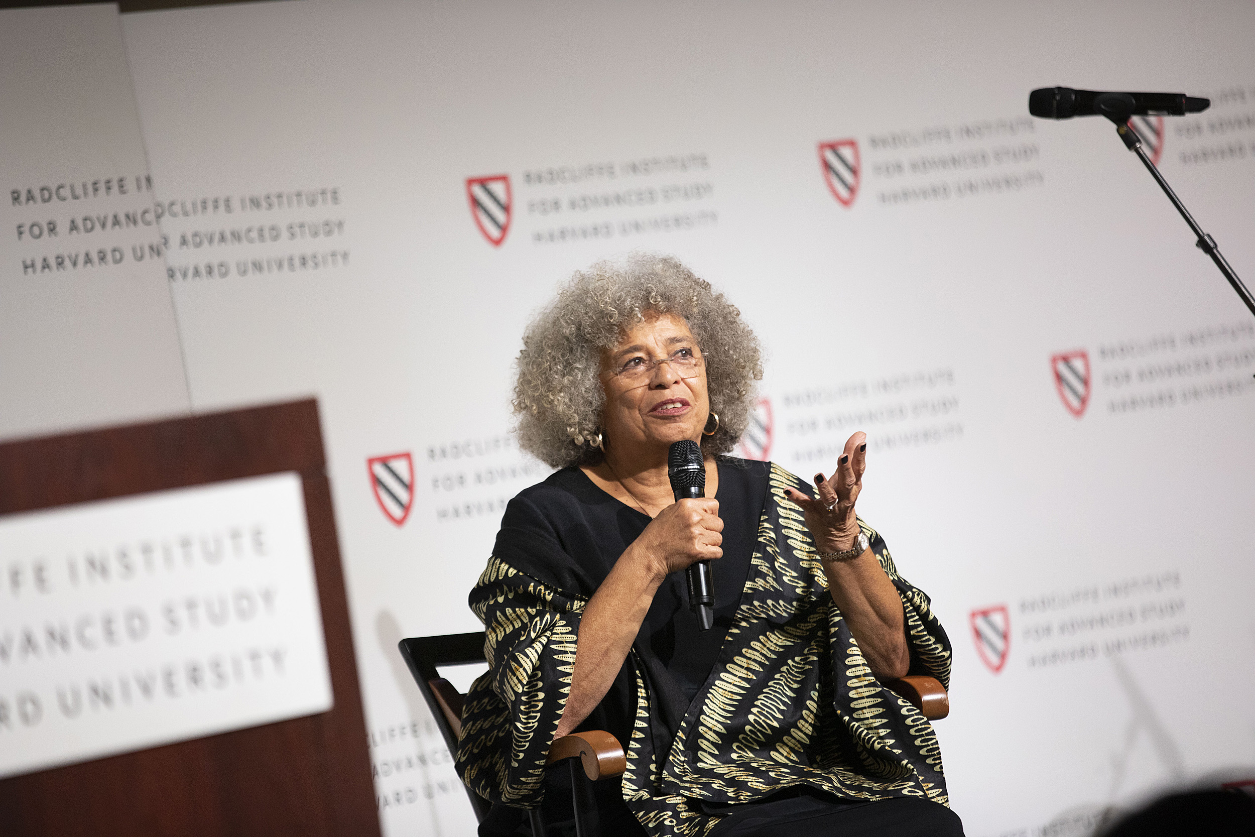 Angela Davis speaking from the stage at Radcliffe.