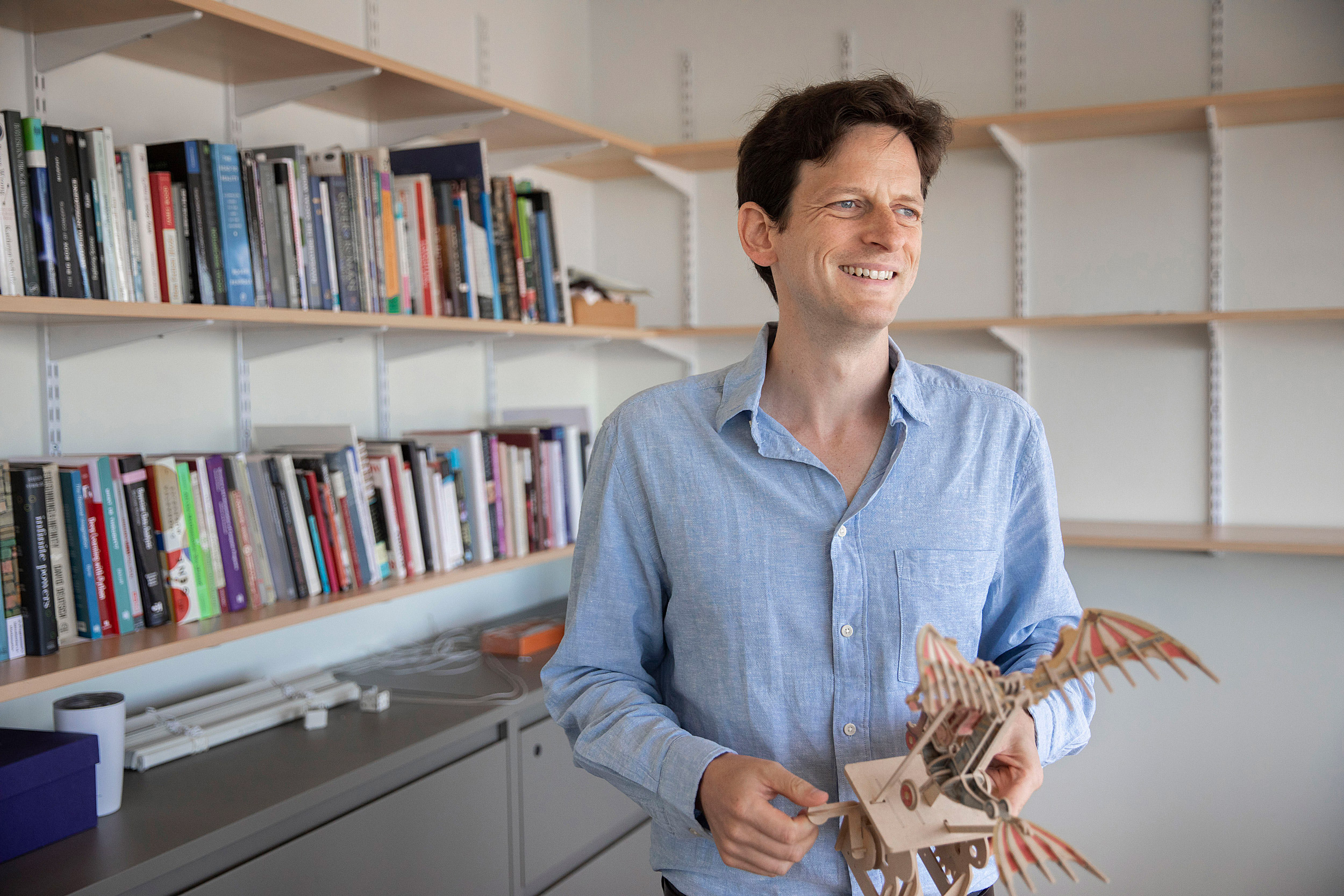 Professor holding an automotron.