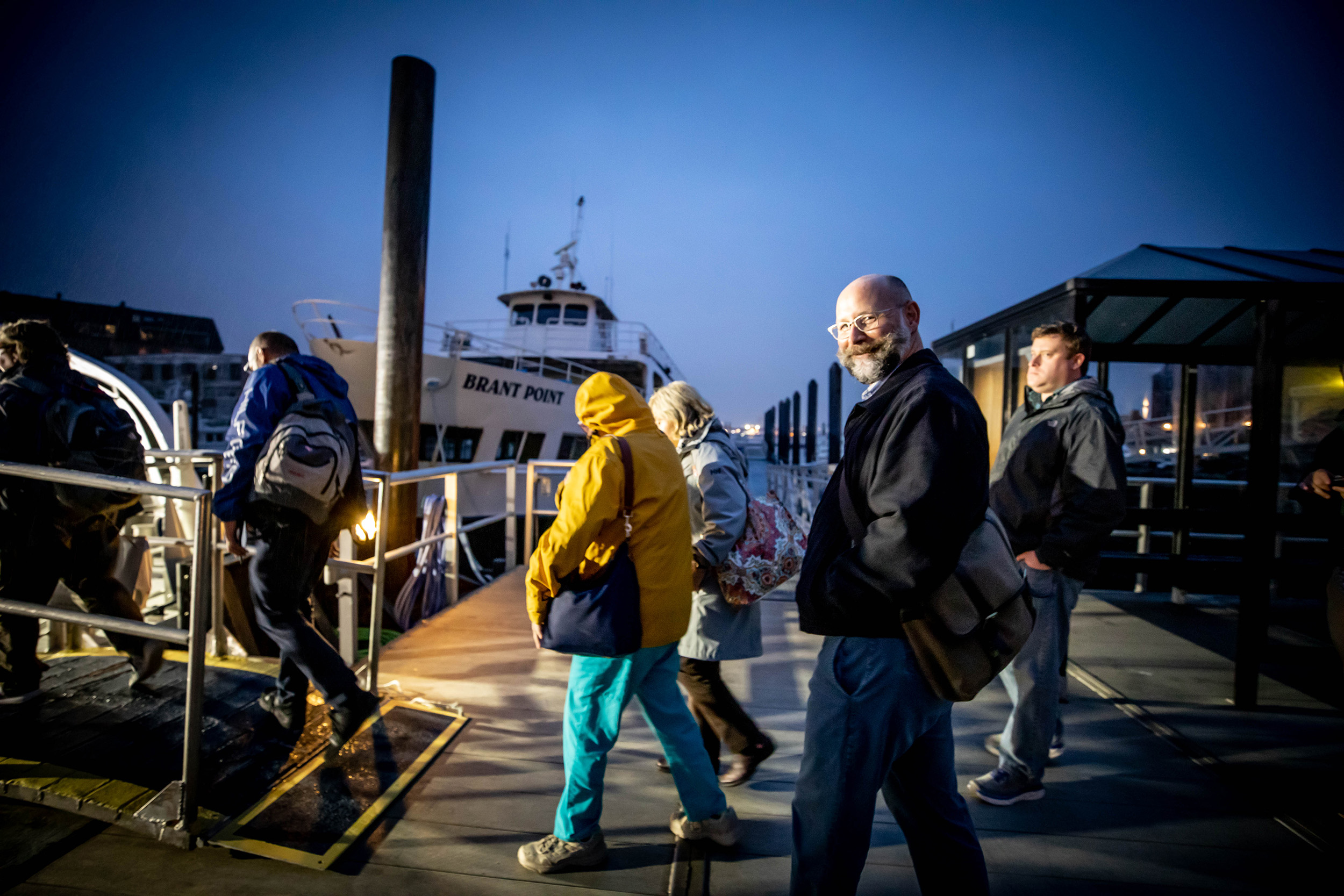 Scott Helms boards the commuter boat from Boston to Hull.