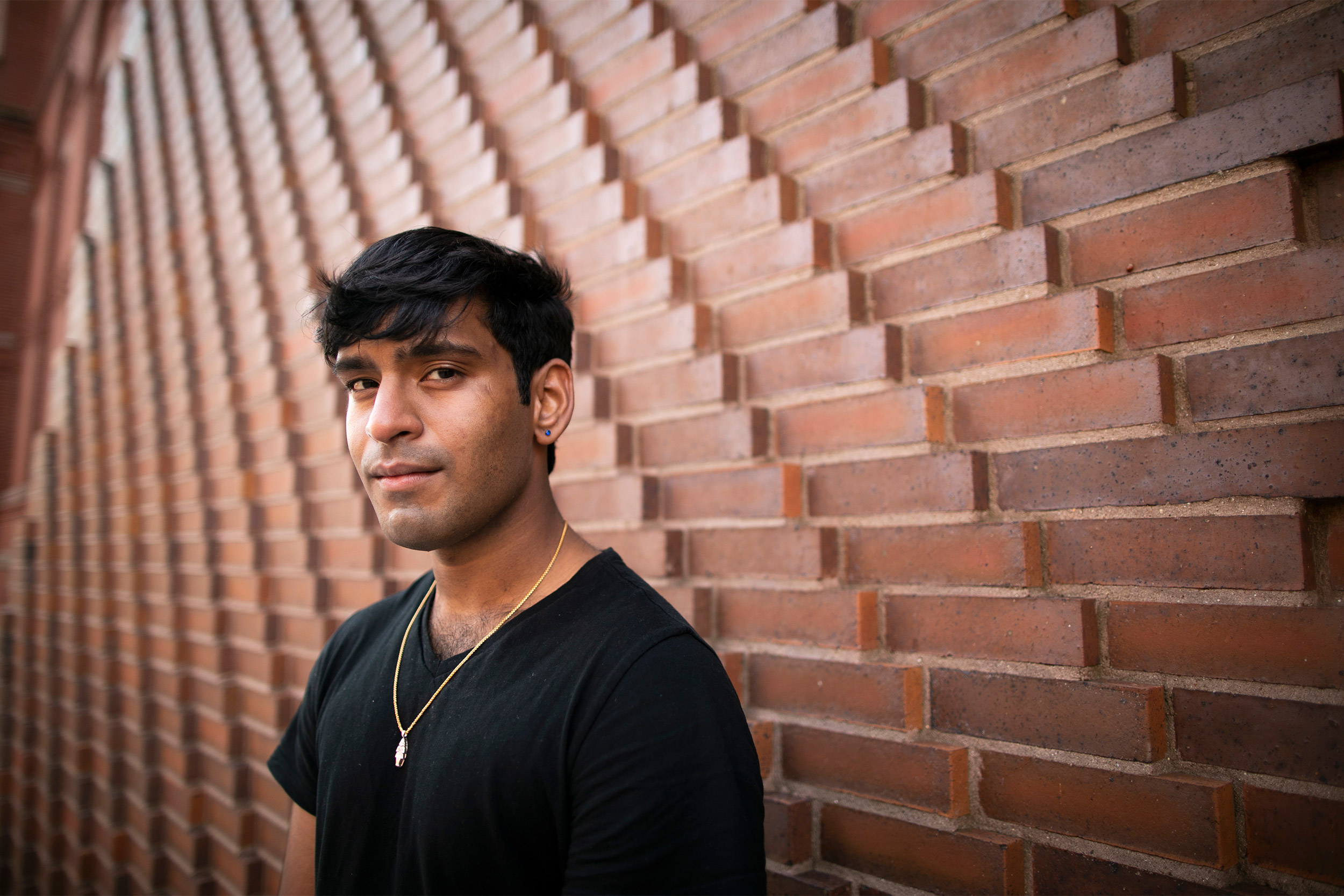 Sai Shanthanand S. Rajagopal standing against a wall at Harvard.