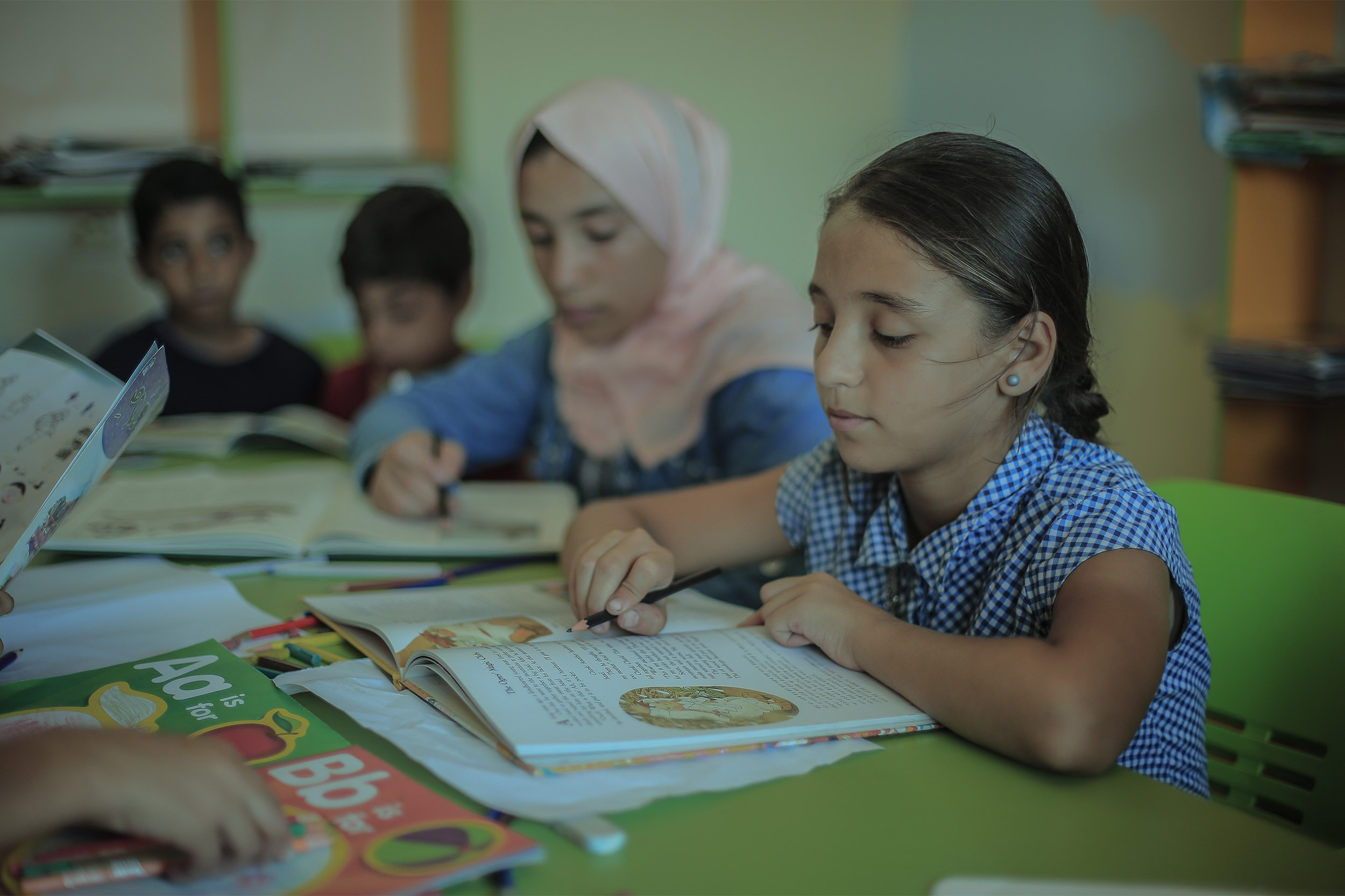 Children reading books.