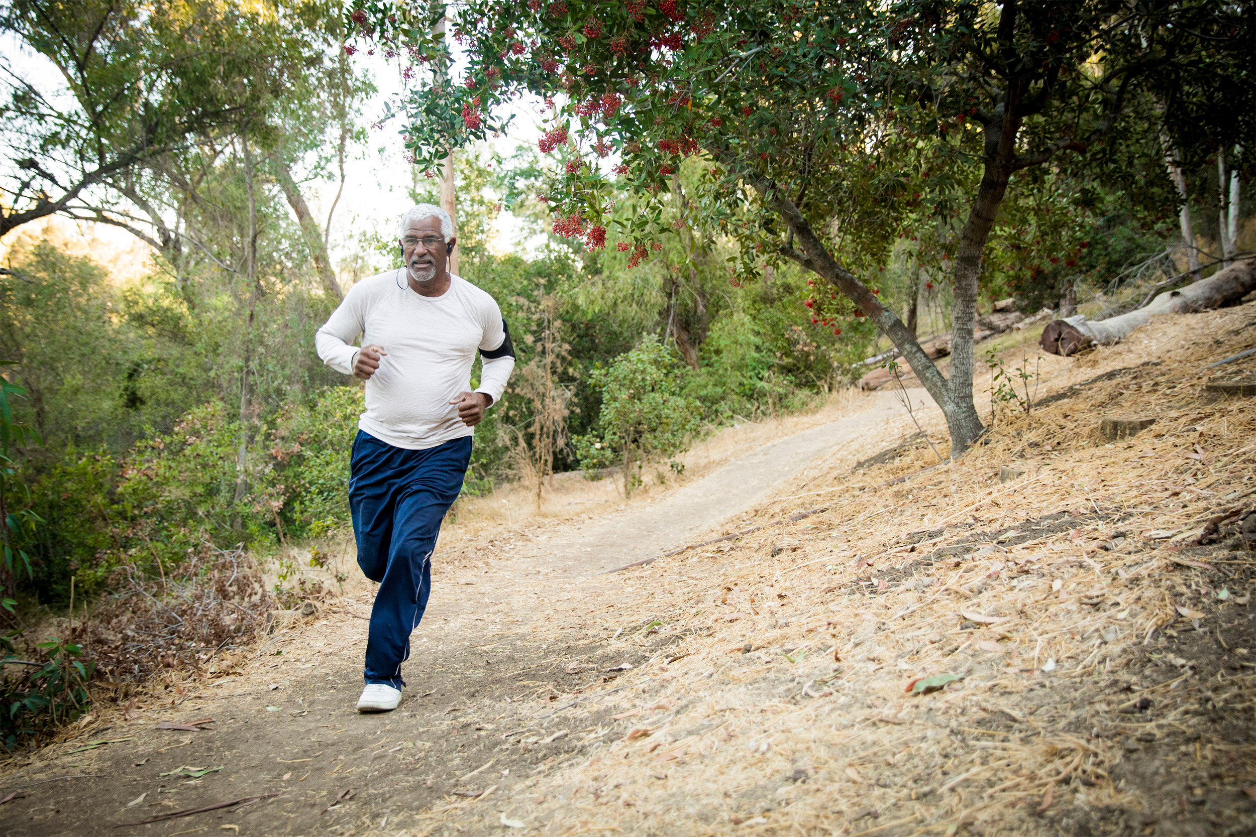 An older man jogging.