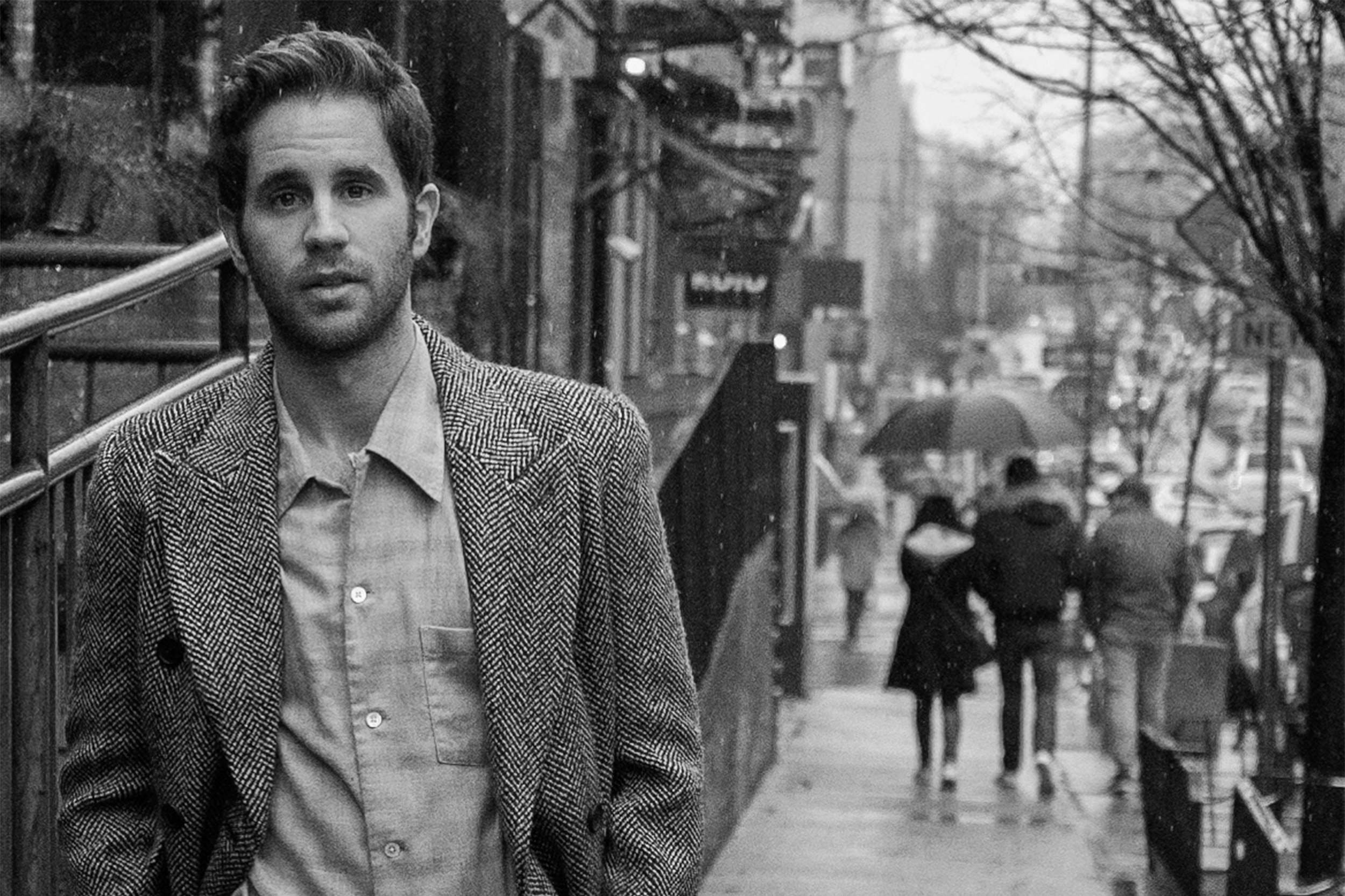 Actor Ben Platt on city street.