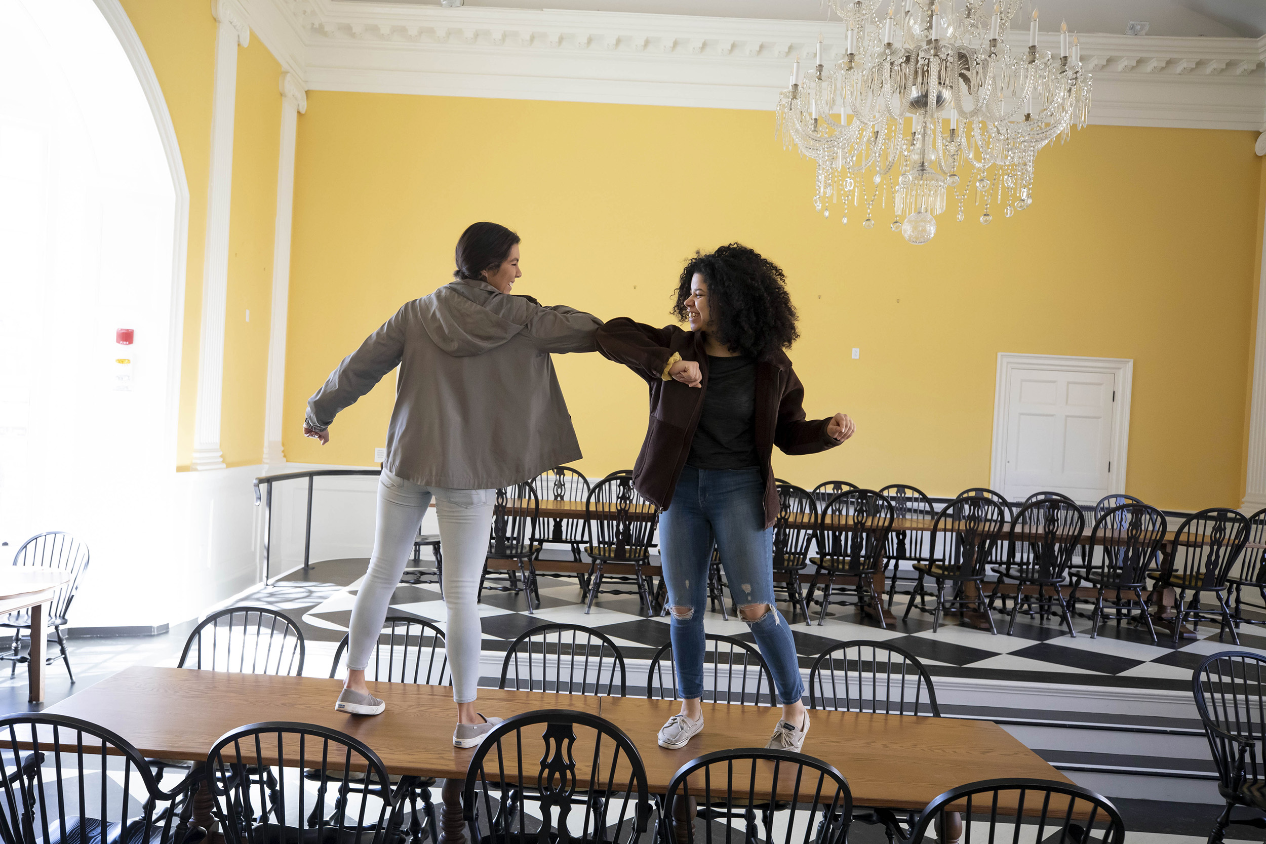 Two students on a table.