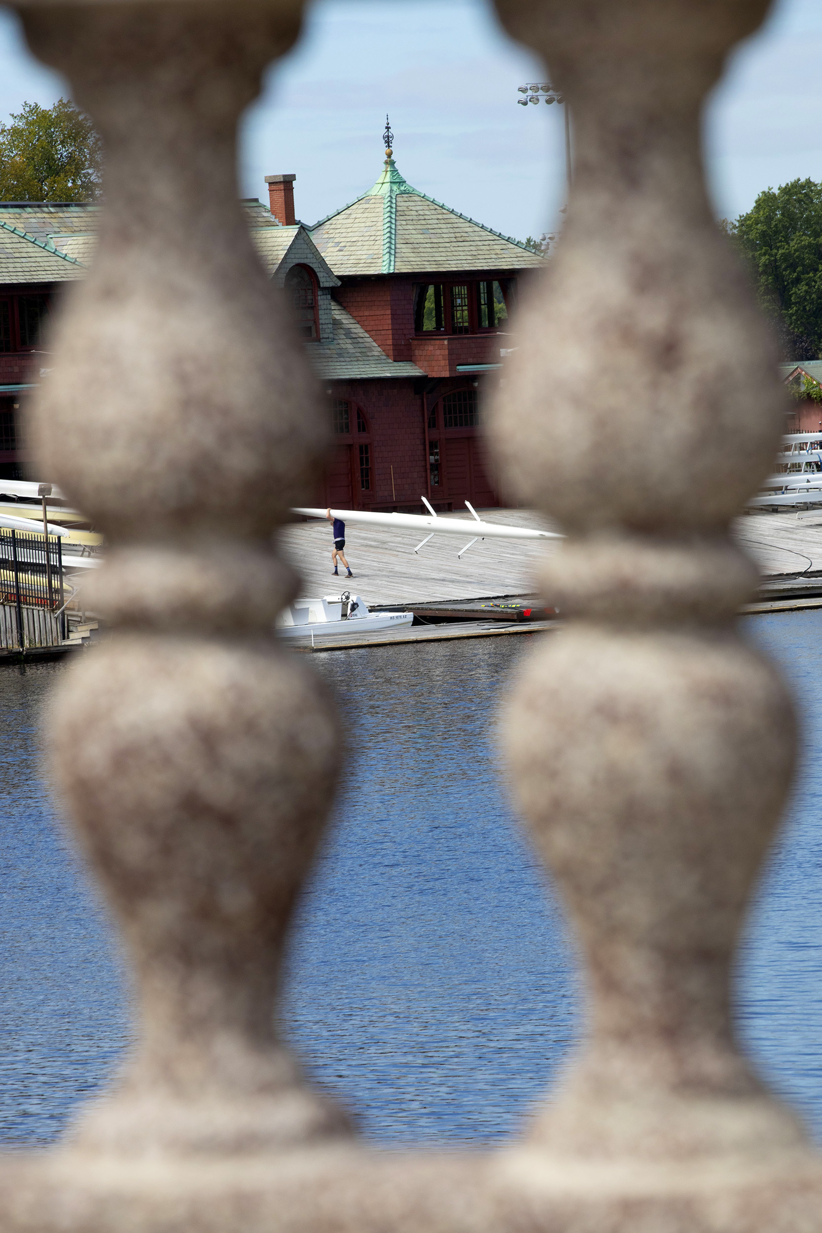 Rowers at the Newell Boat House return from sculling on the Charles River.