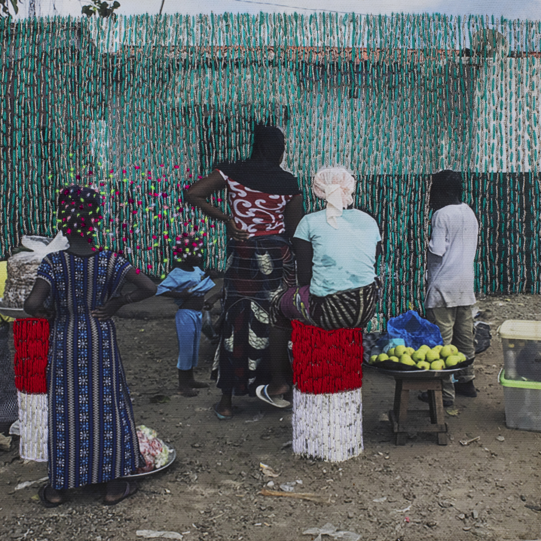 Embroidered photograph of marketplace.