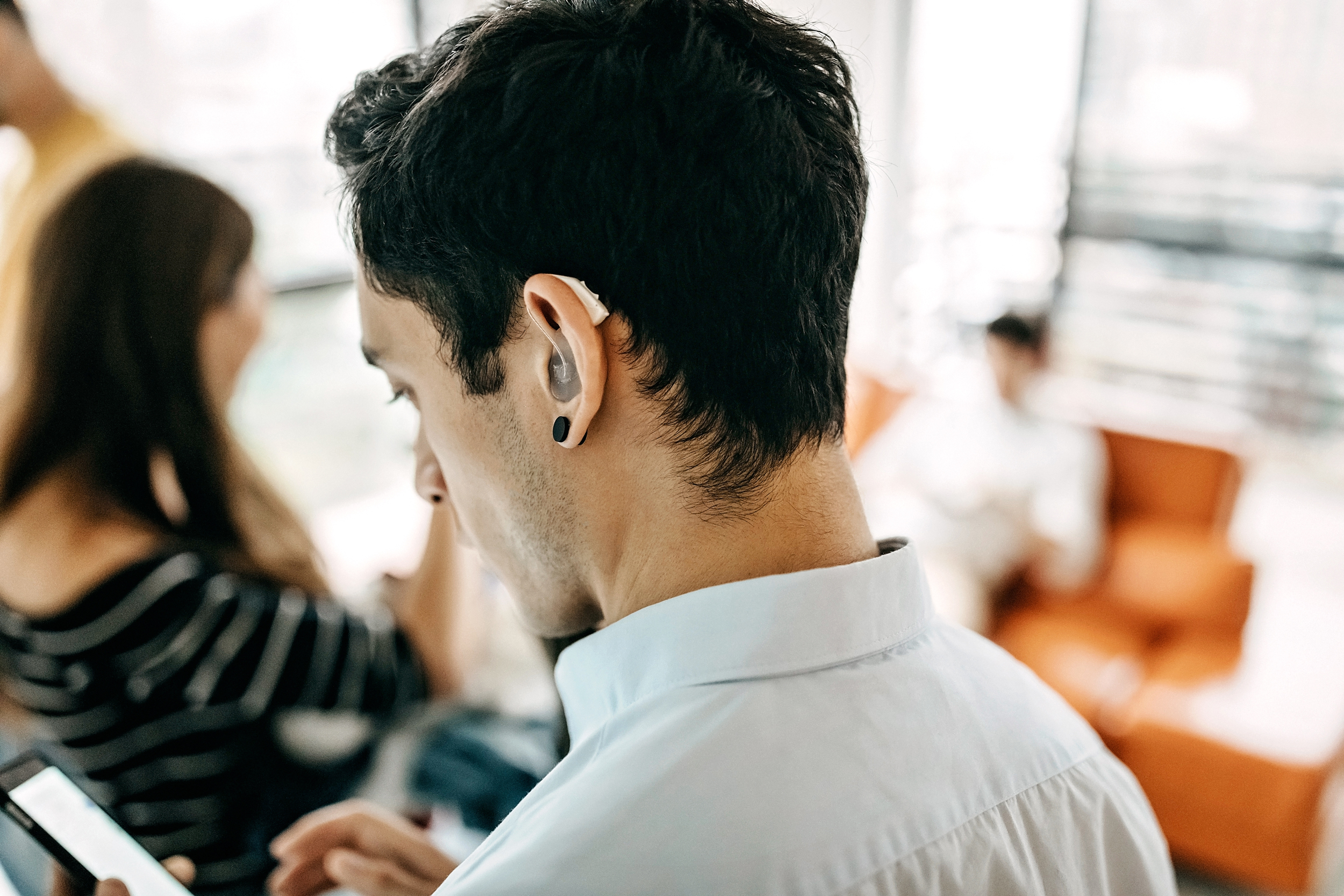 Person wearing hearing aid.