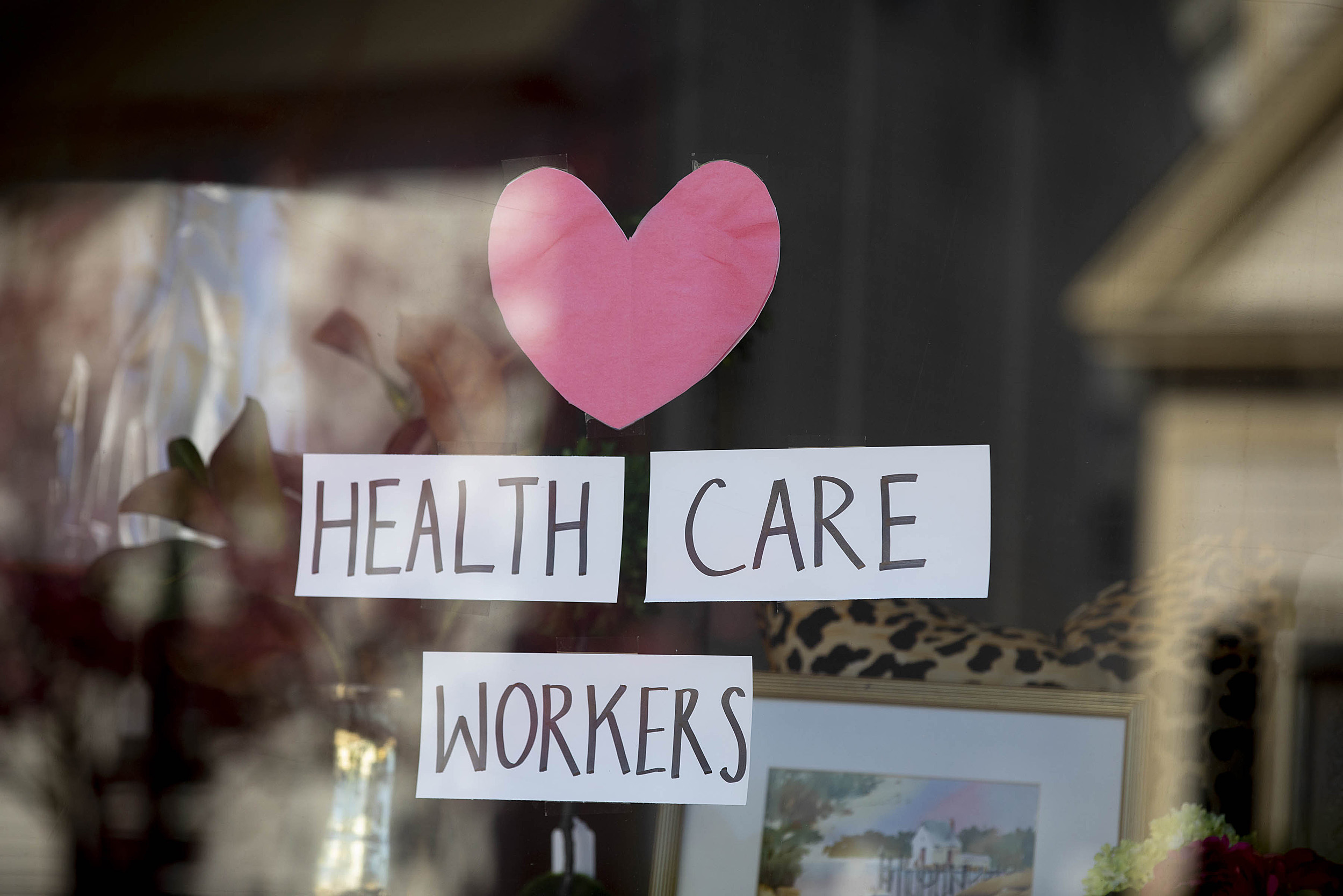 Thank you sign for health care workers in a window.