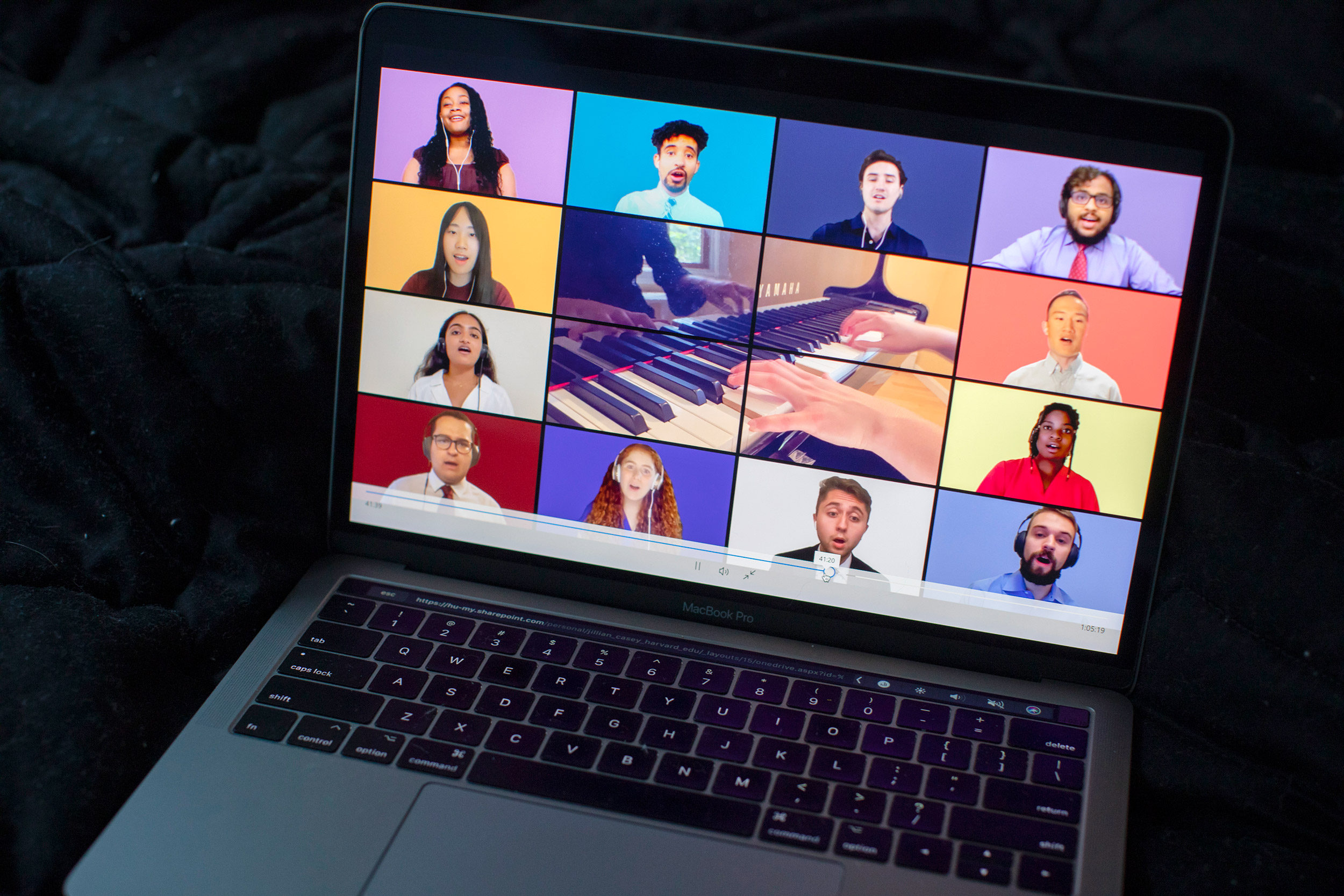 Chorus singing on screen.