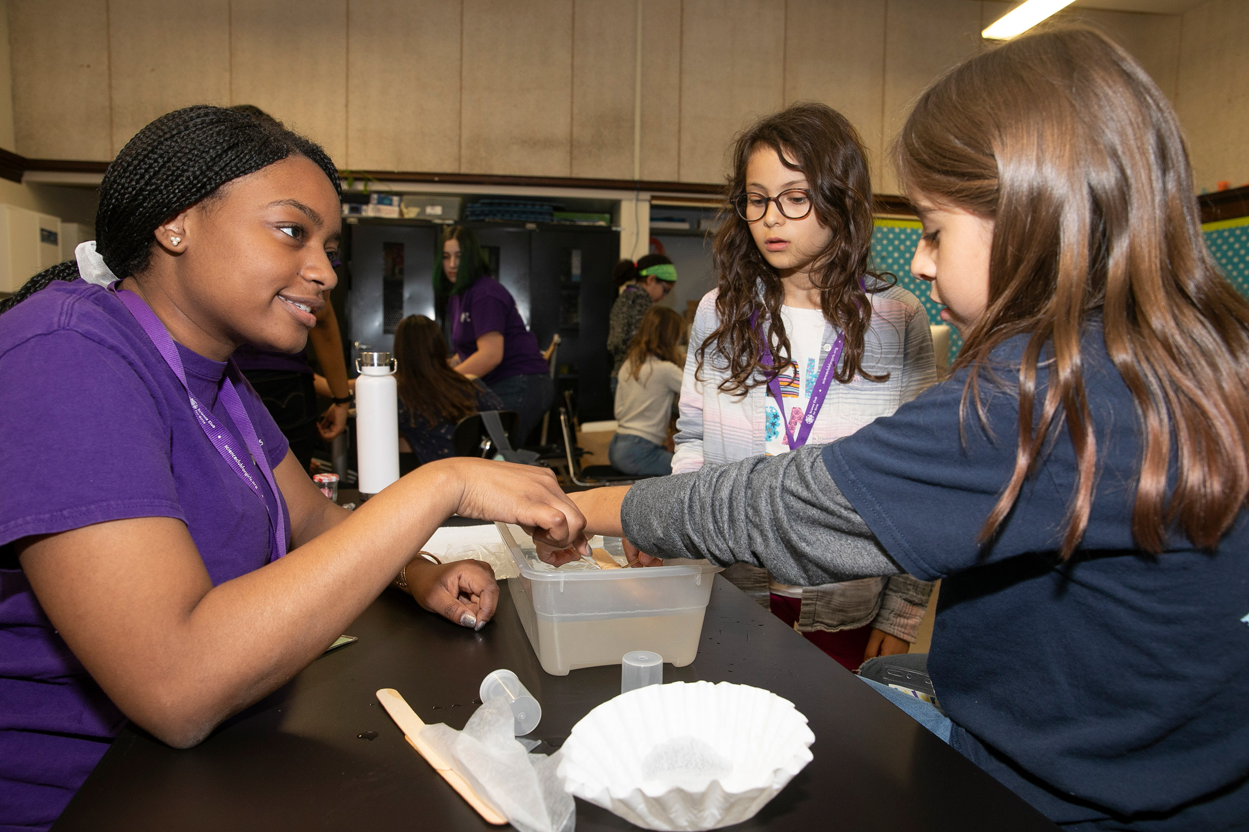 Ashley Cooper '21 instructs a pair of very focused students.