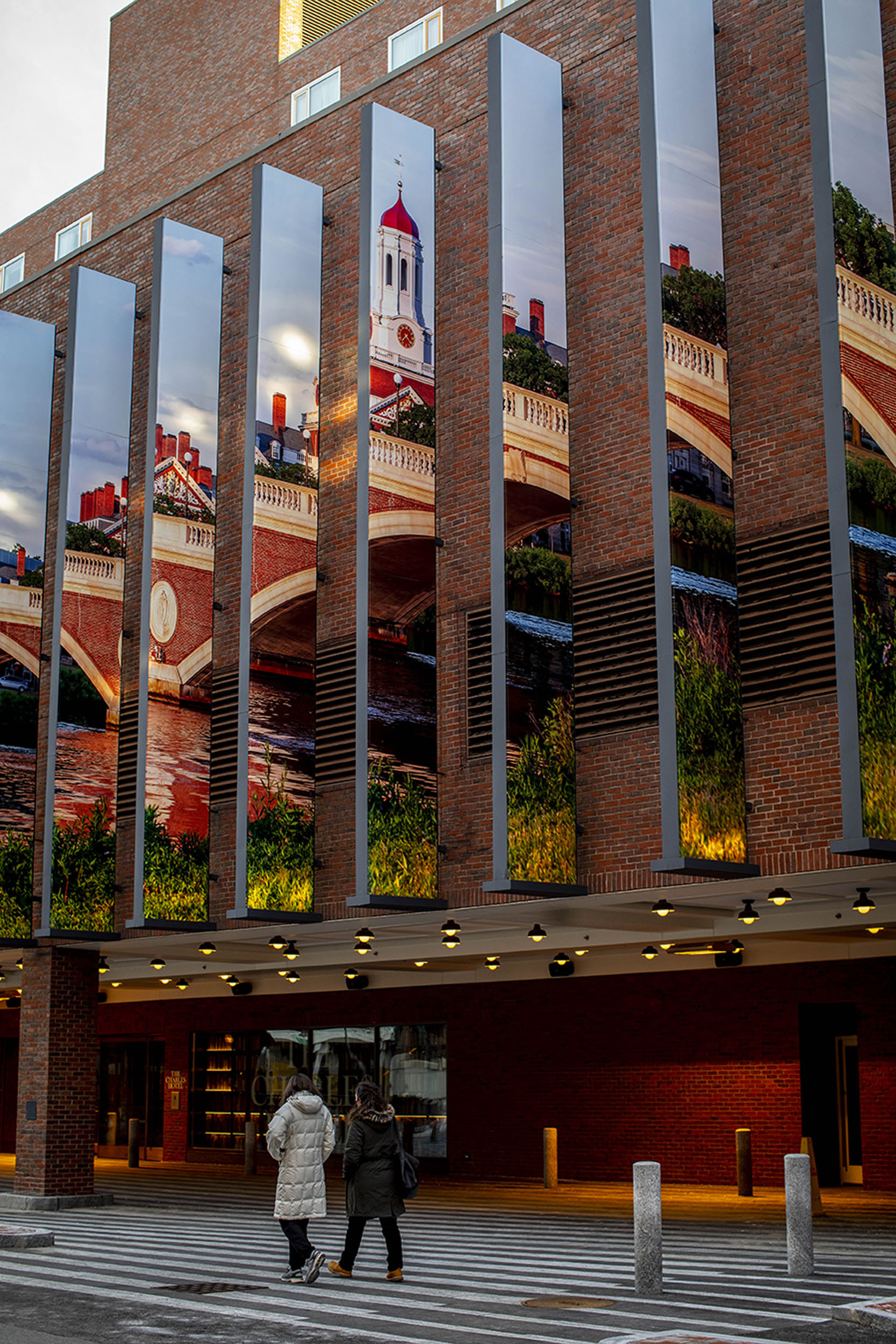 A large photograph of Dunster House hangs above the entrance to the Charles Hotel.