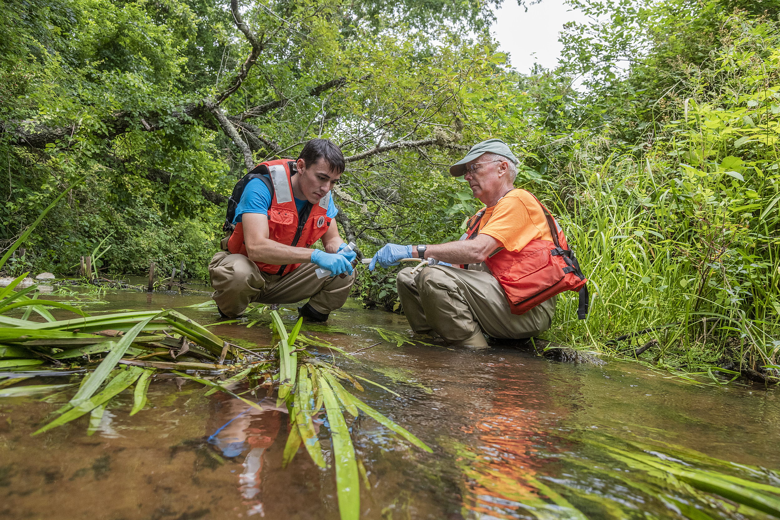 Scientists test water.