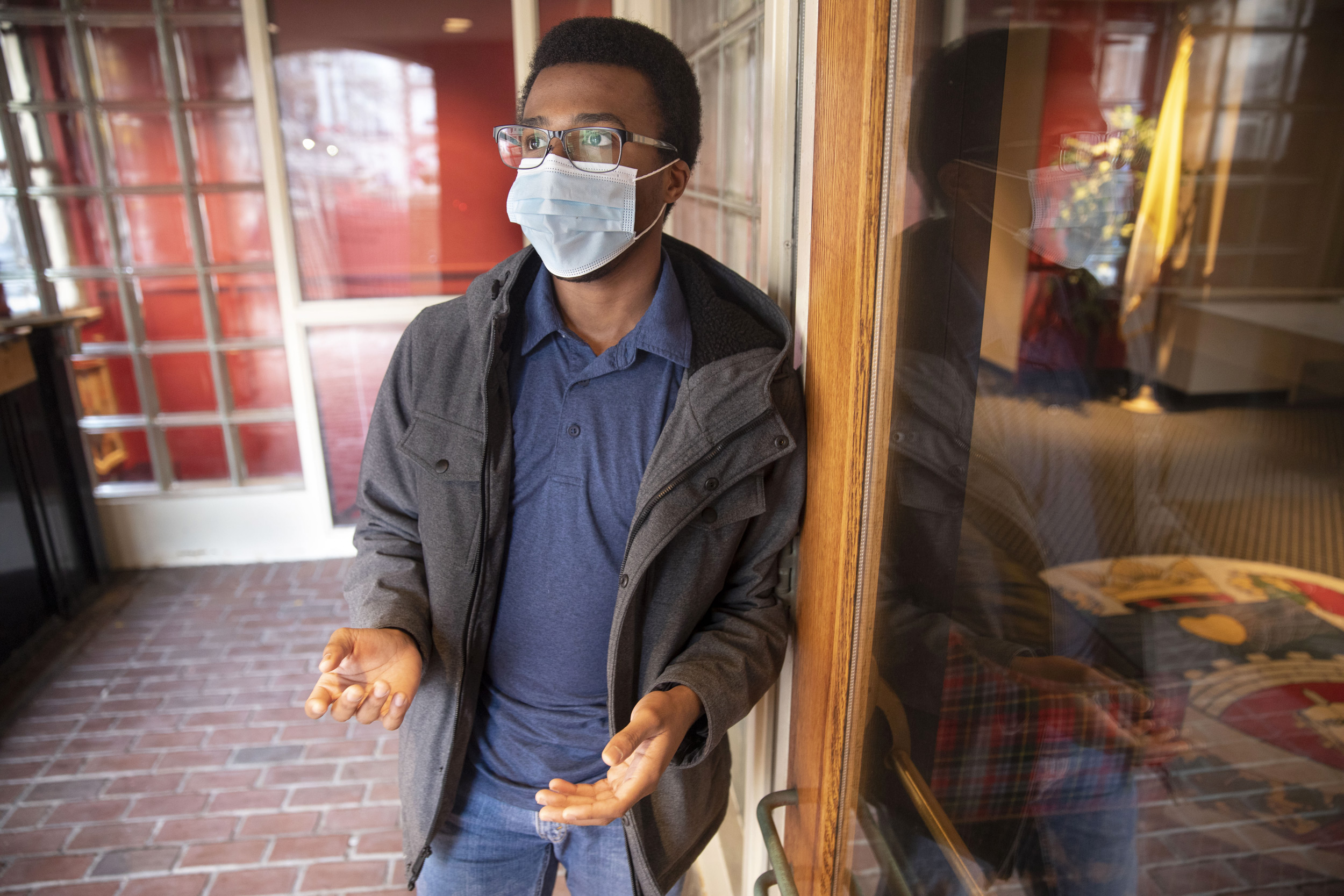 Tresor Shimiye is seen at The Harvard Catholic Student Center where he practices his Christian faith.