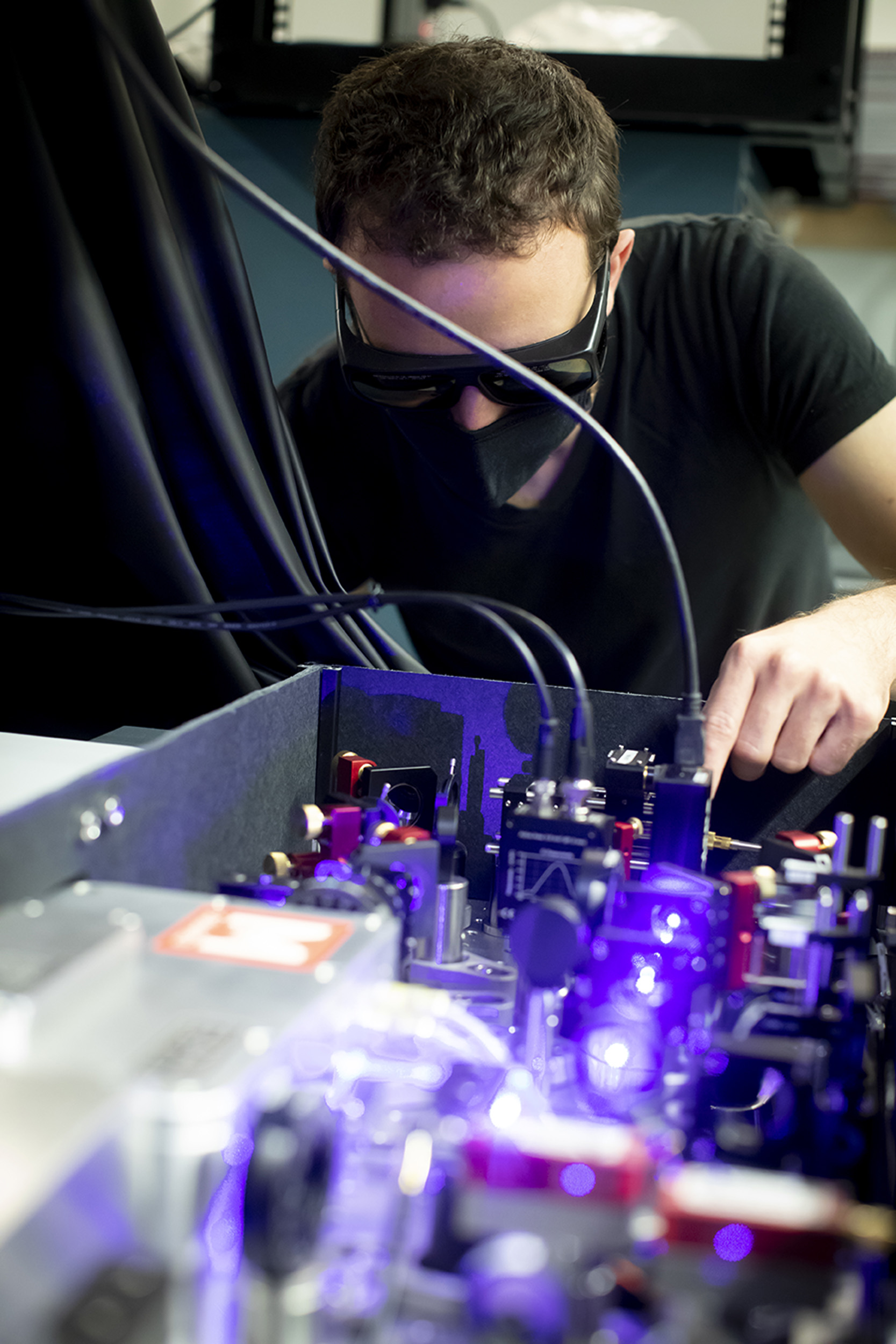 Dolev Bluvstein looking at a 420 mm laser.