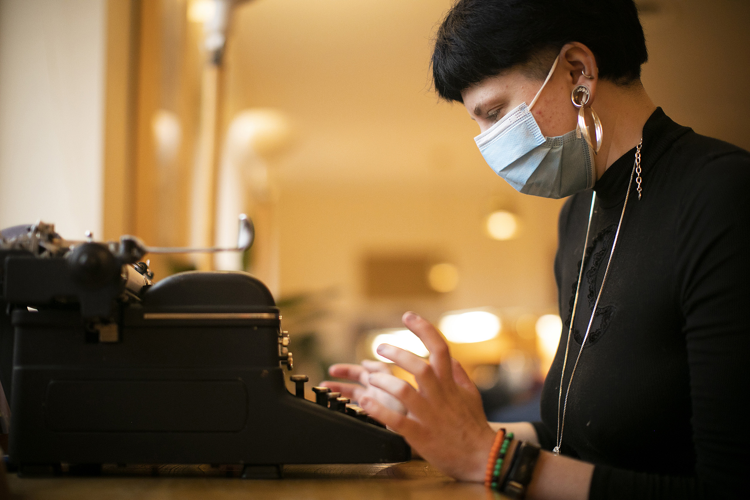 Lizzy Gagne using typewriter.