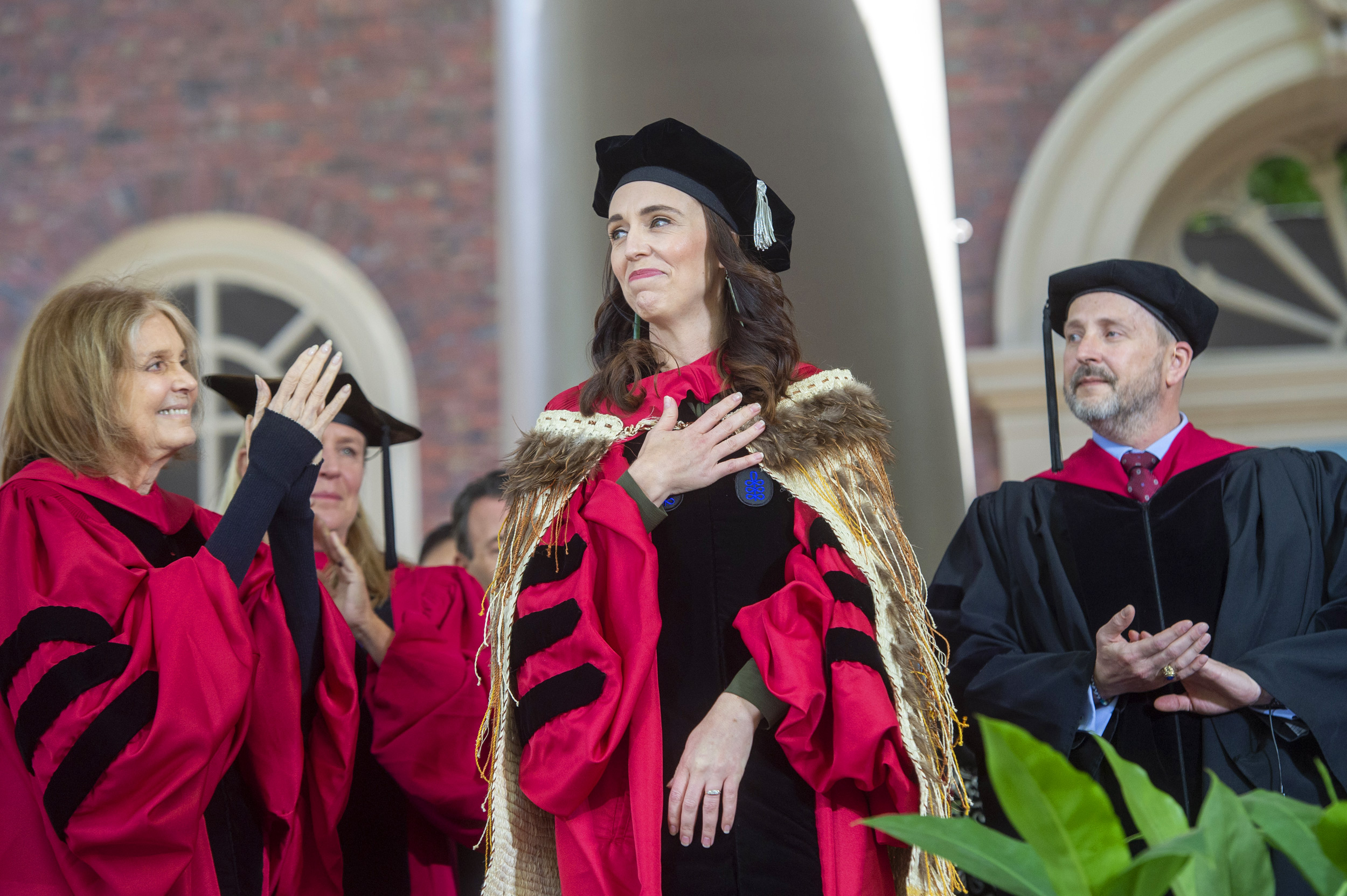 Jacinda Kate Laurell Ardern places her hand over her heart as they receive her honorary degrees.