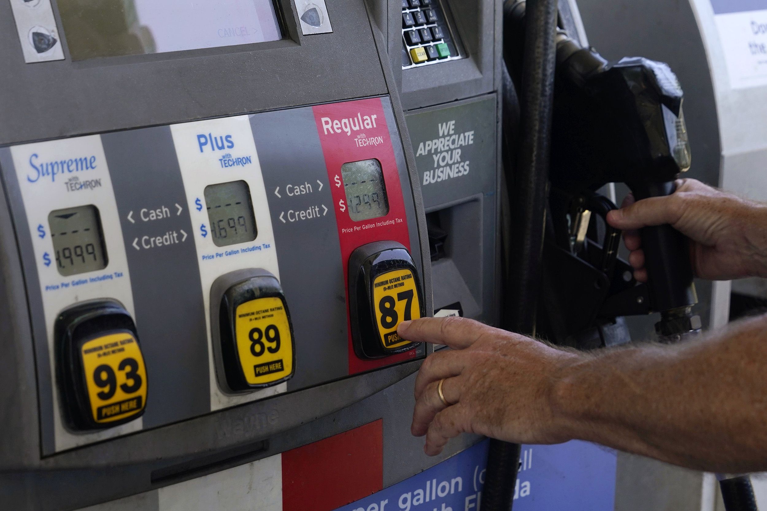 Motorist pumps gas.