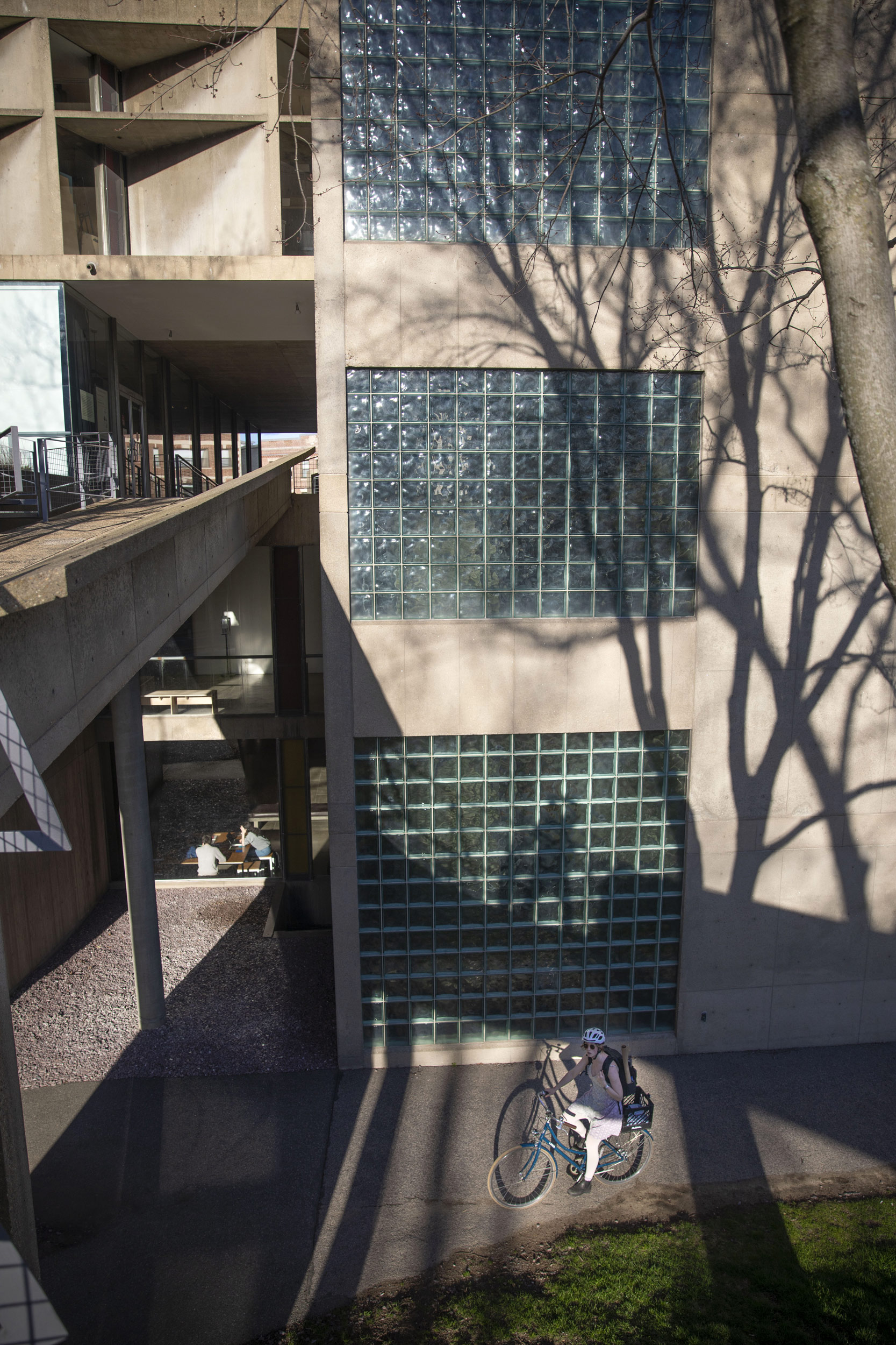 A bicyclist rides past the Carpenter Center for the Visual Arts.