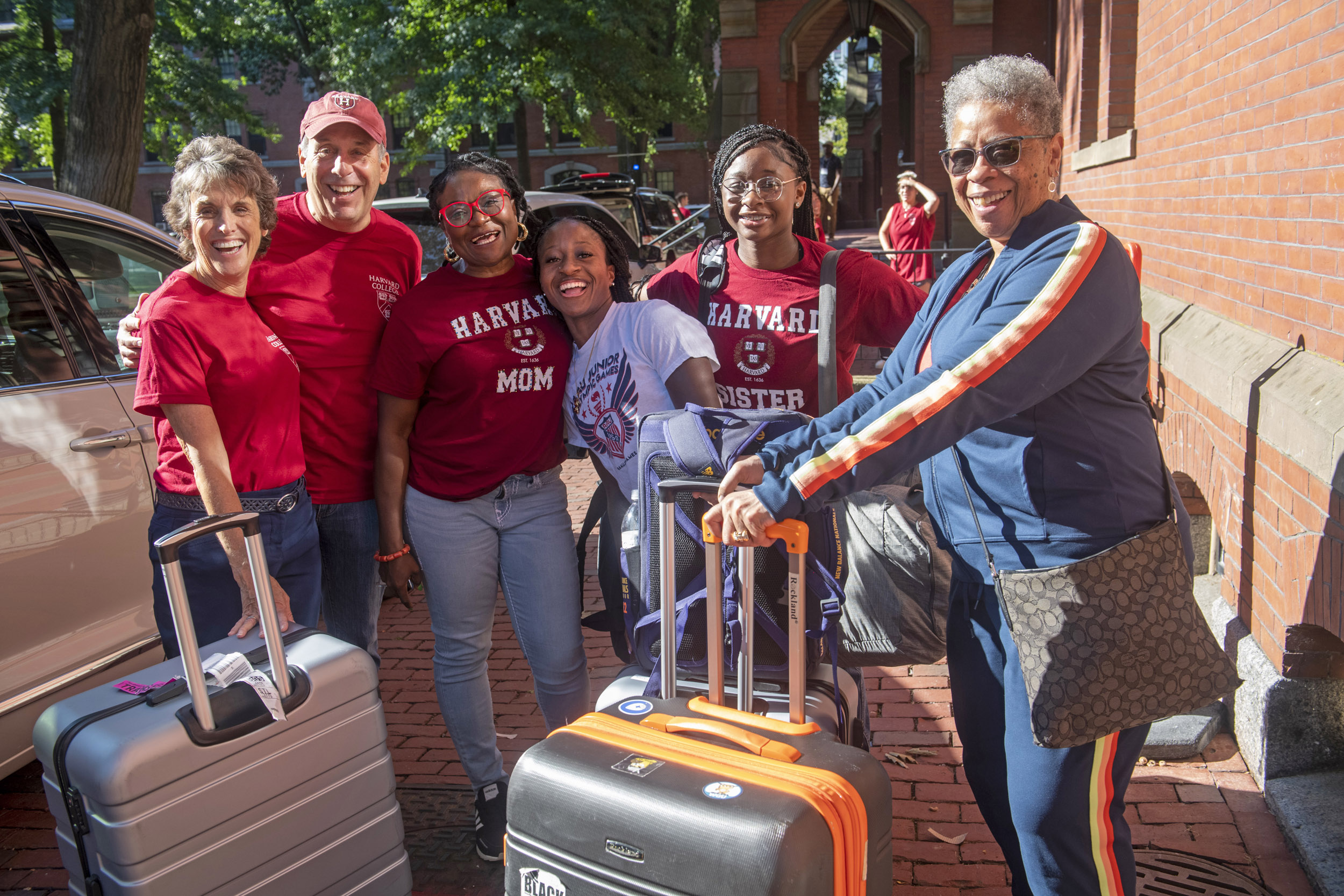 Adele Fleet Bacow and Harvard President Larry Bacow pose for a group photo.