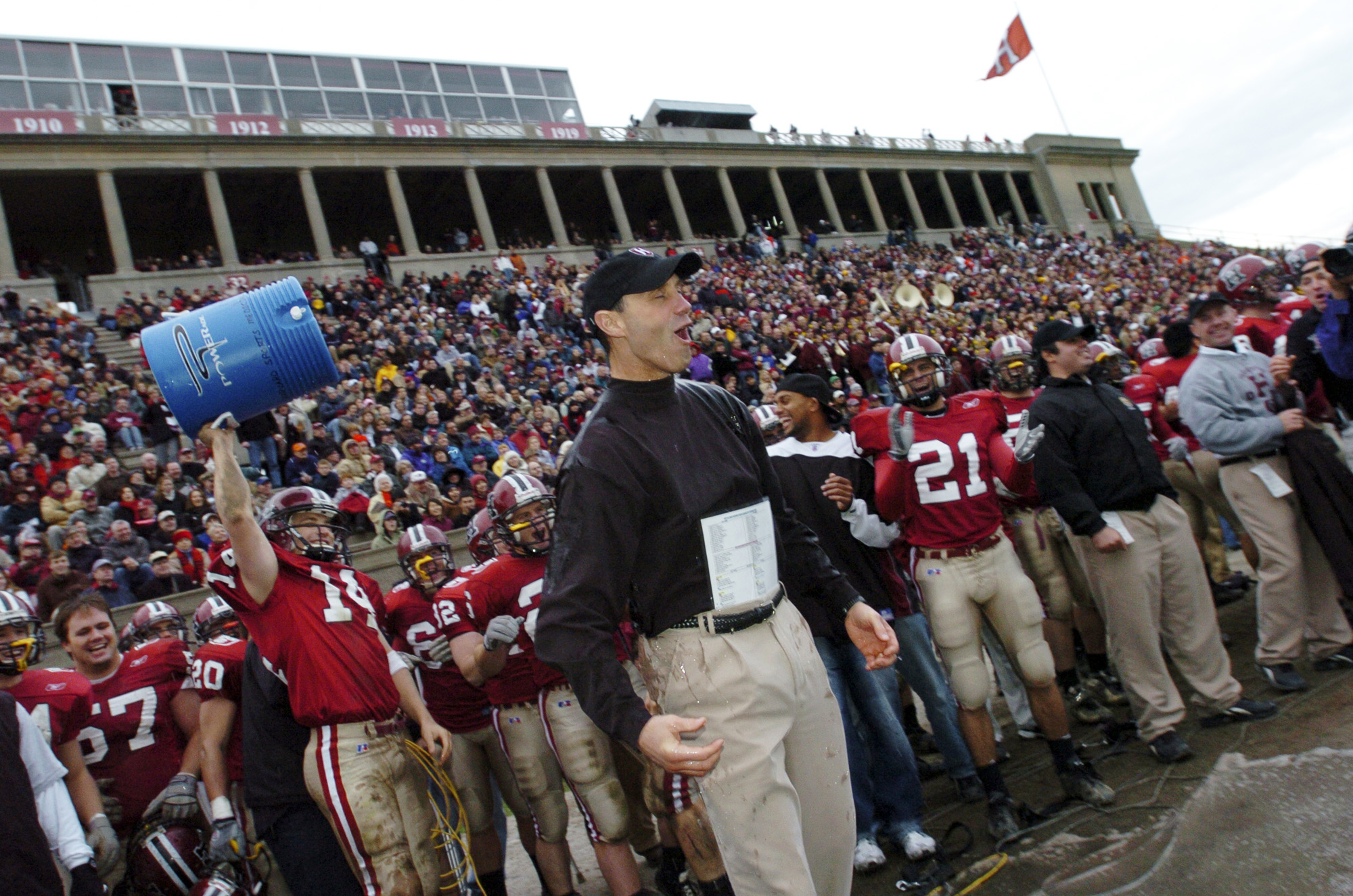 Tim Murphy reacts to getting water dumped on him after victory over Yale at Harvard Stadium in 2004.