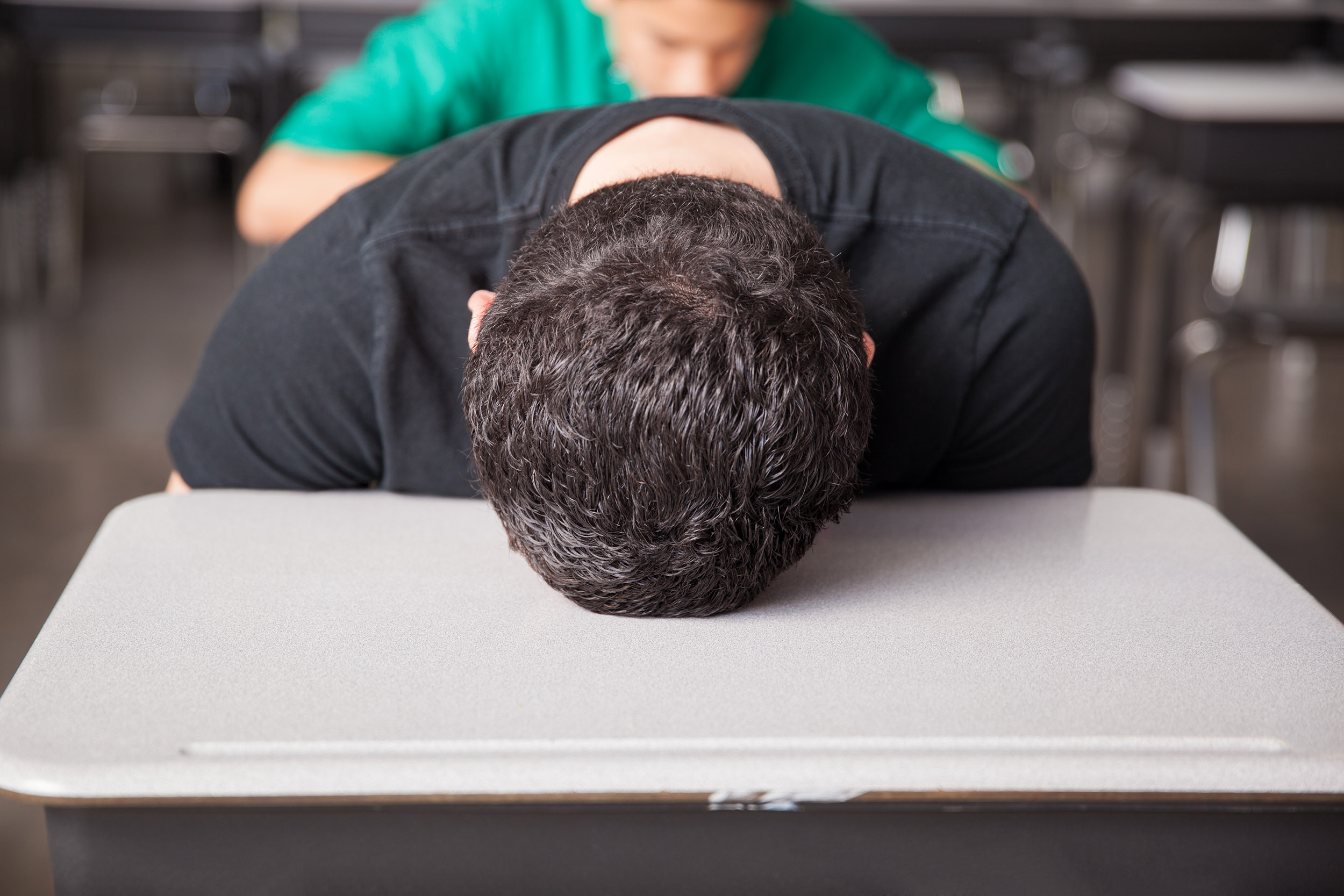 High school student asleep on desk.