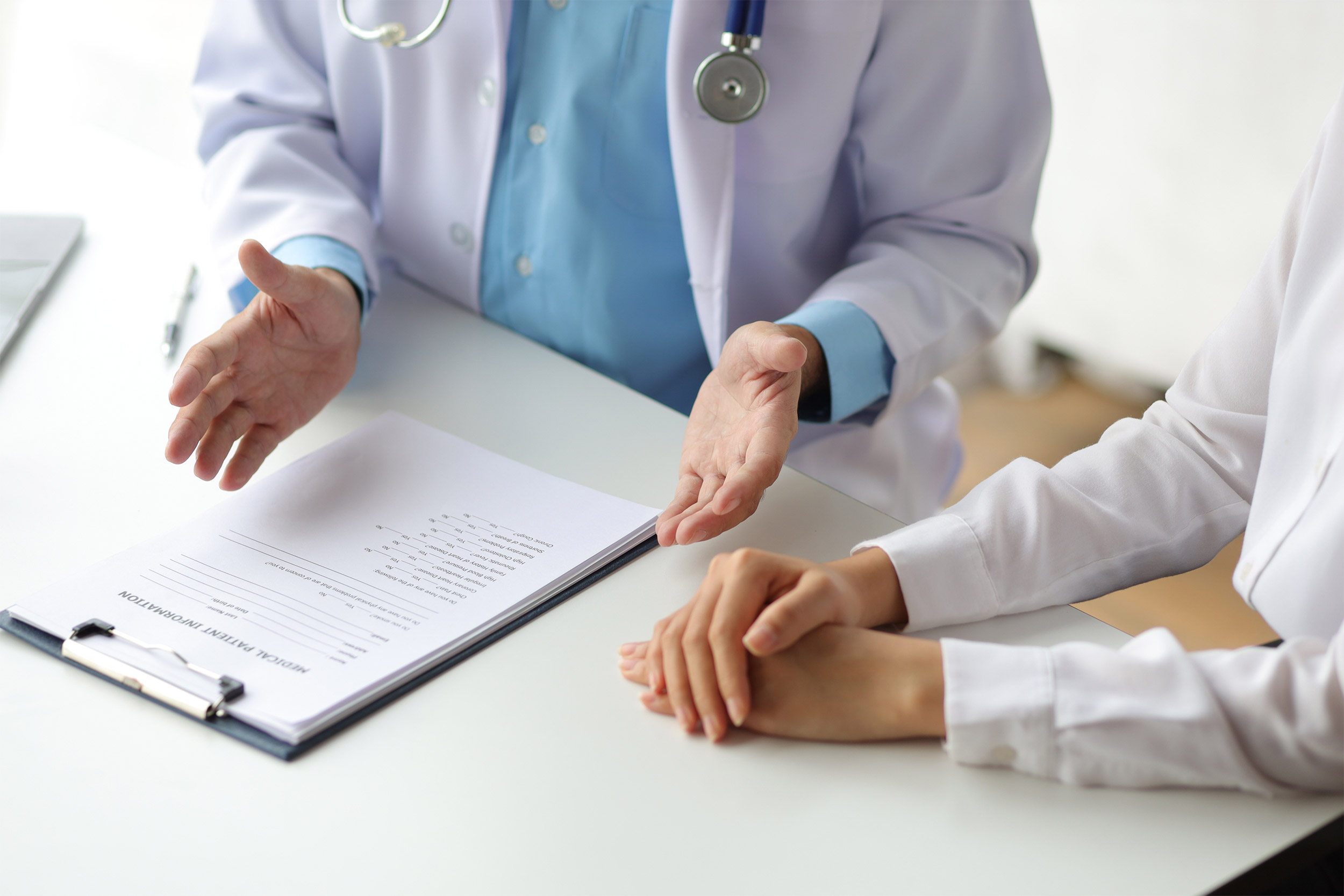 Doctor talking to female patient.